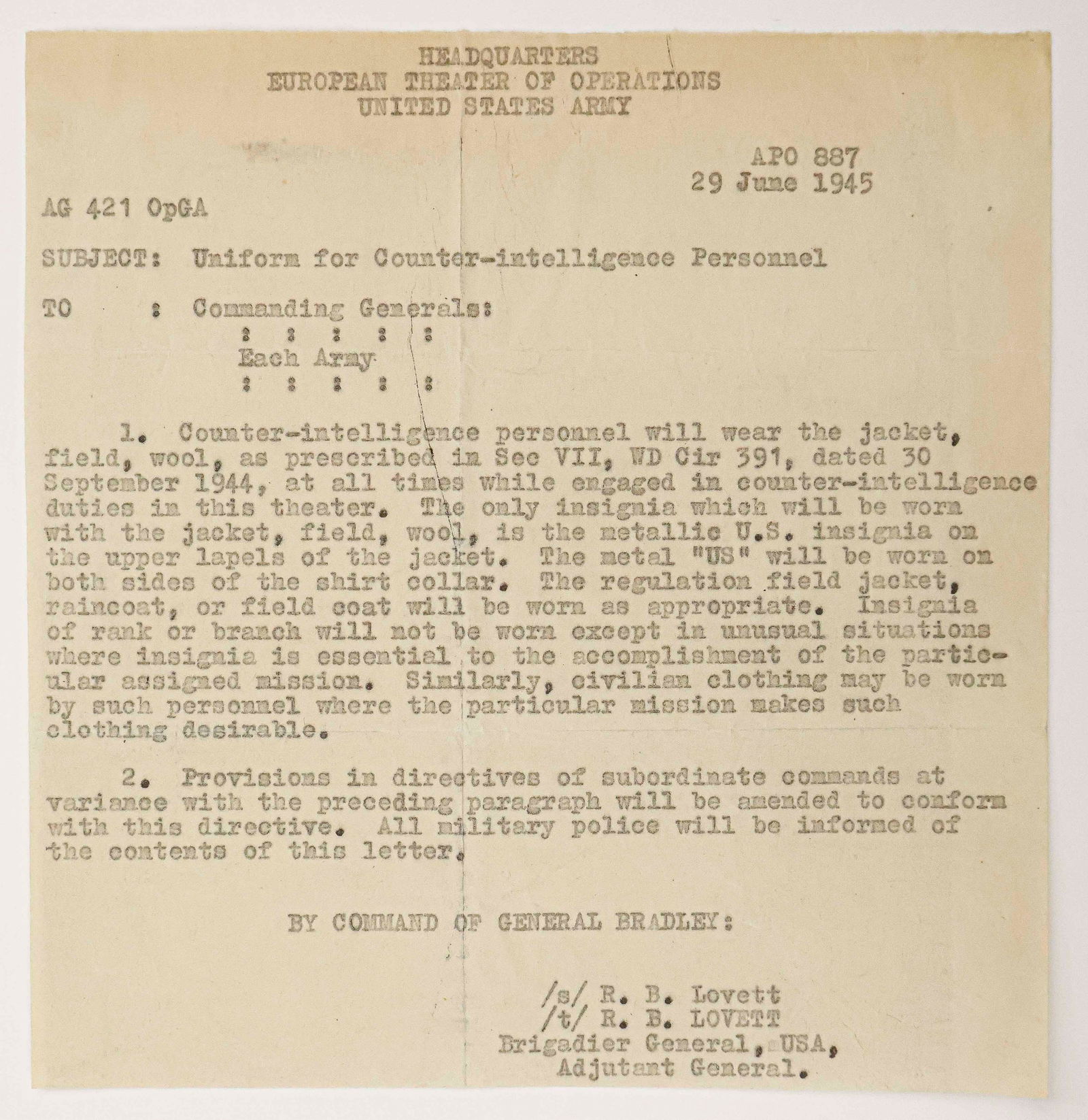 'UNIFORM FOR COUNTER-INTELLIGENCE PERSONNEL': An original World War II date typescript document, unsigned, issued by Brigadier General Ralph B. Lovett, Adjutant General, by command of General Omar Bradley, 1p. 8vo., Headquarters, European Theater