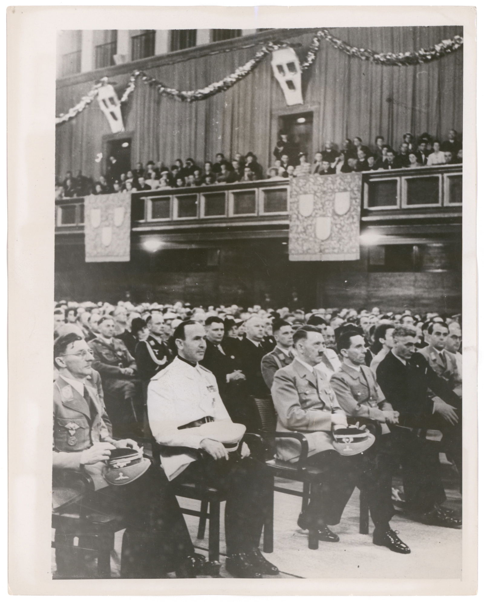 ADOLF HITLER PRESS PHOTOS (5): A fine group of five original press photographs about 8 x 10 in. each, depicting Hitler a variety of scenes. Each is backstamped, and many have press blurbs as well. Includes: Hitler addressing a crow