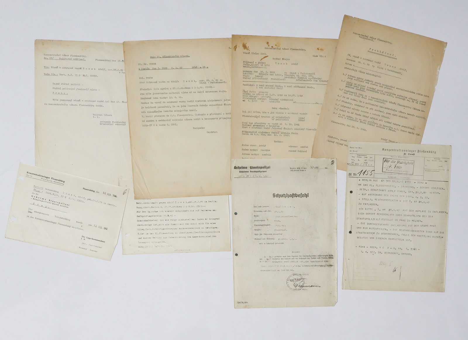 CZECH PRISONER ADOLF TOMEK PRISONER FILE WITH HEYDRICH REFERENCES: Lot of eight documents concerning Czech political prisoner Adolf Tomek, born in Hertin in 1889 and a bank director. Tomek was arrested by the GESTAPO in October, 1941 and sent to the Kleine Festung