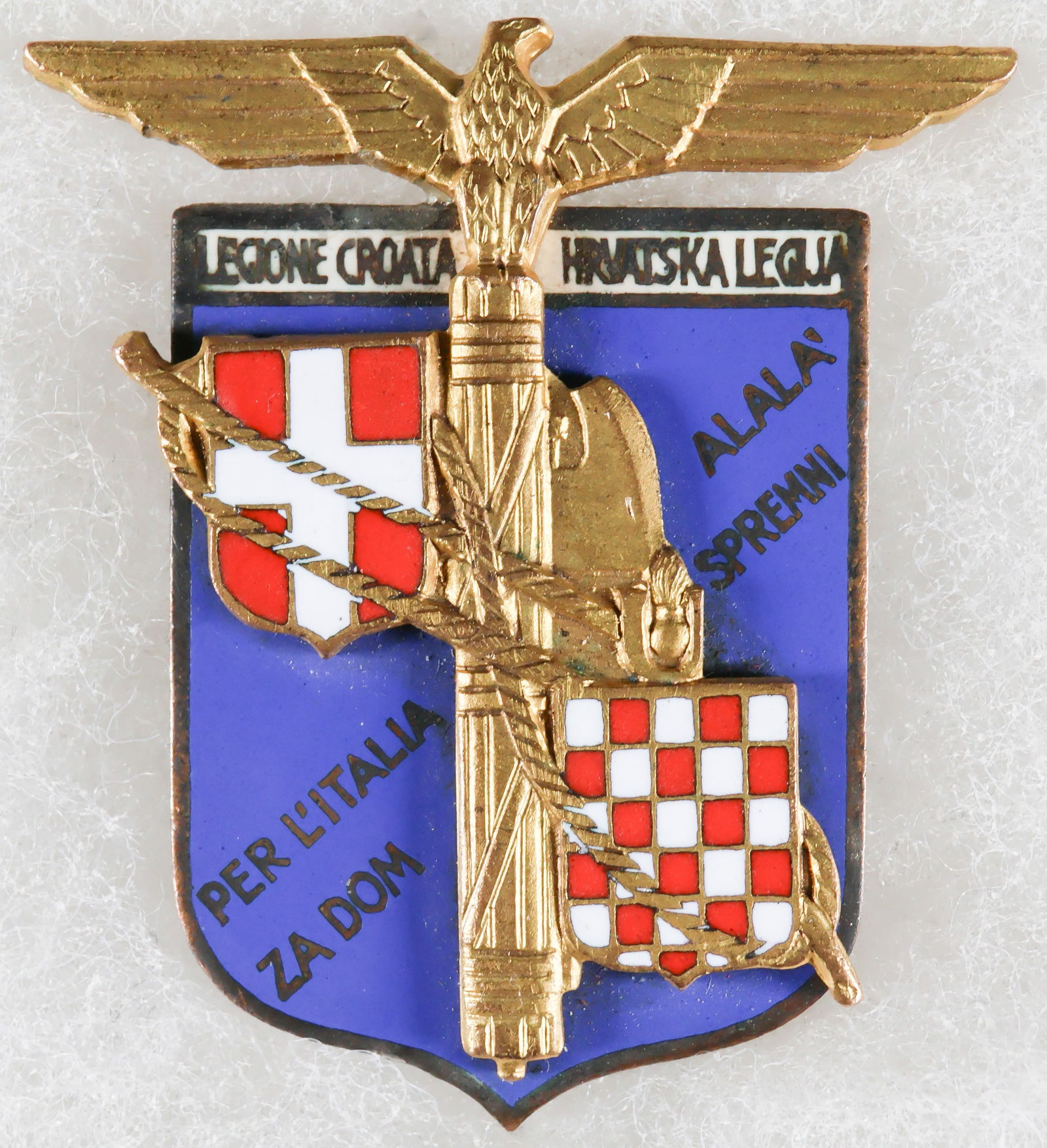 ITALIAN-CROATIAN LEGION OFFICER'S BADGE: A excessively rare 1942 Italian-Croatian Legion Officer’s Badge in gilded bronze and enamels, by S. Johnson, Milan, 37 x 42mm, in extremely fine condition. The Italian-Croatian Legion was