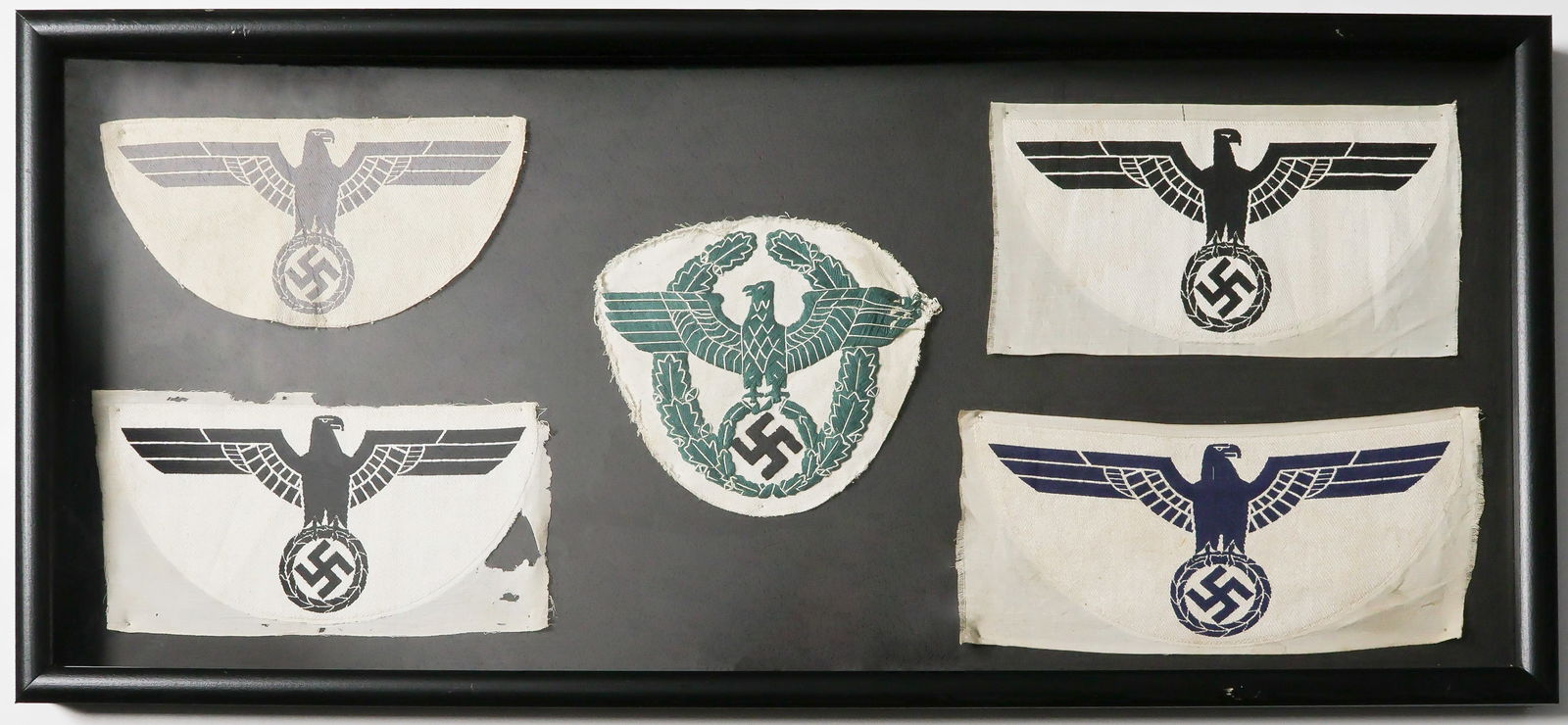 GERMAN SPORTS SHIRT INSIGNIA (5): Lot of five pieces of Geramn Thir5d Reich sports shirt chest insignia, three unissued, the others apparently clothing-removed. Included are two each from the army and Kriegsmarine, one much rarer