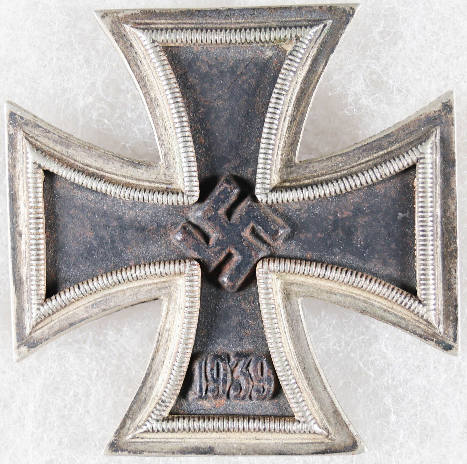 IRON CROSS FIRST CLASS: German 1939 Iron Cross, 1st Class, black painted areas very good save a touch of oxidation about the swastika and year, very slightly bent. Pin on reverse marked 'L/13' for maker Paul Meybauer,