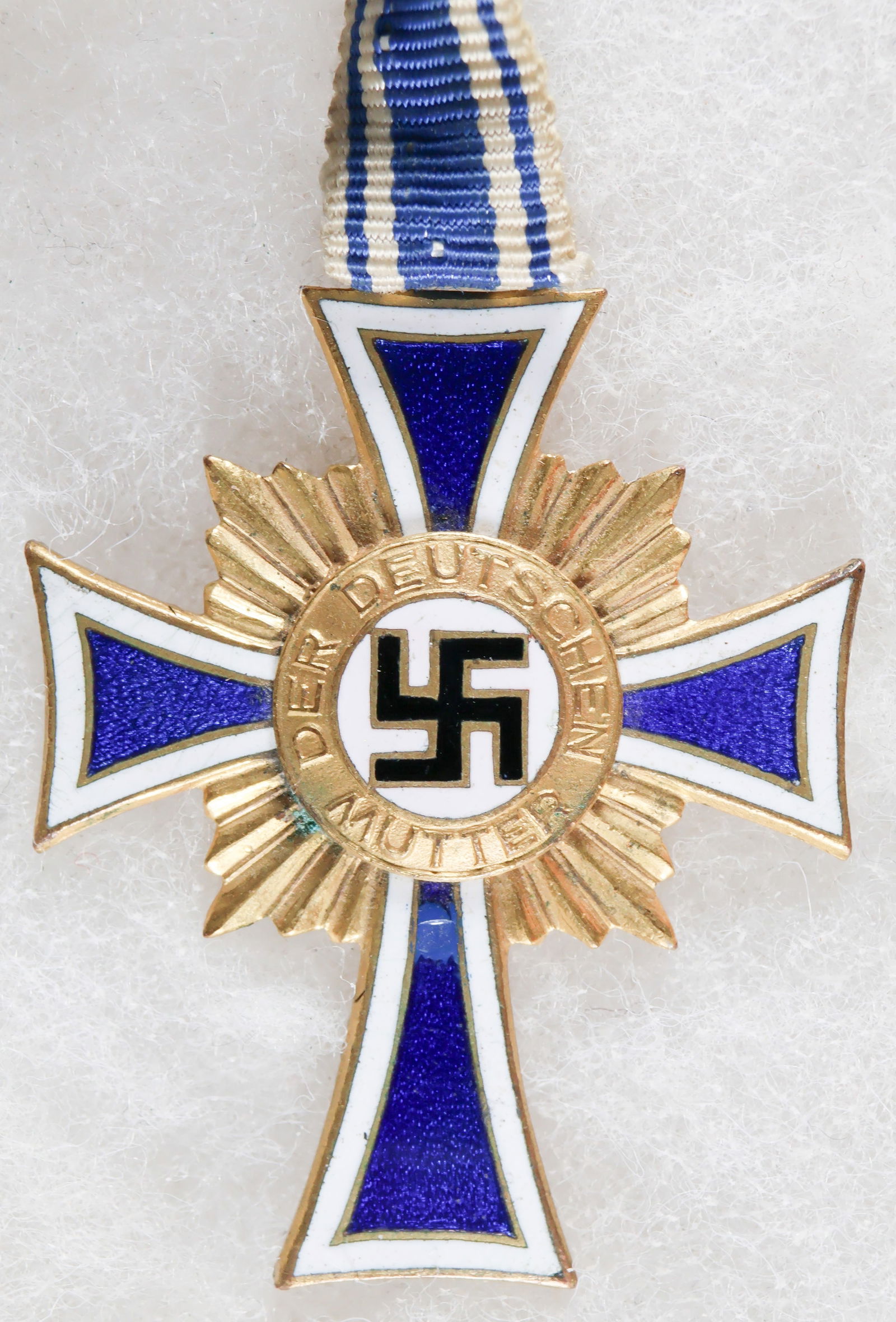MOTHER'S CROSS IN GOLD: German Mother's Cross in Gold, with original neck ribbon. Near fine.