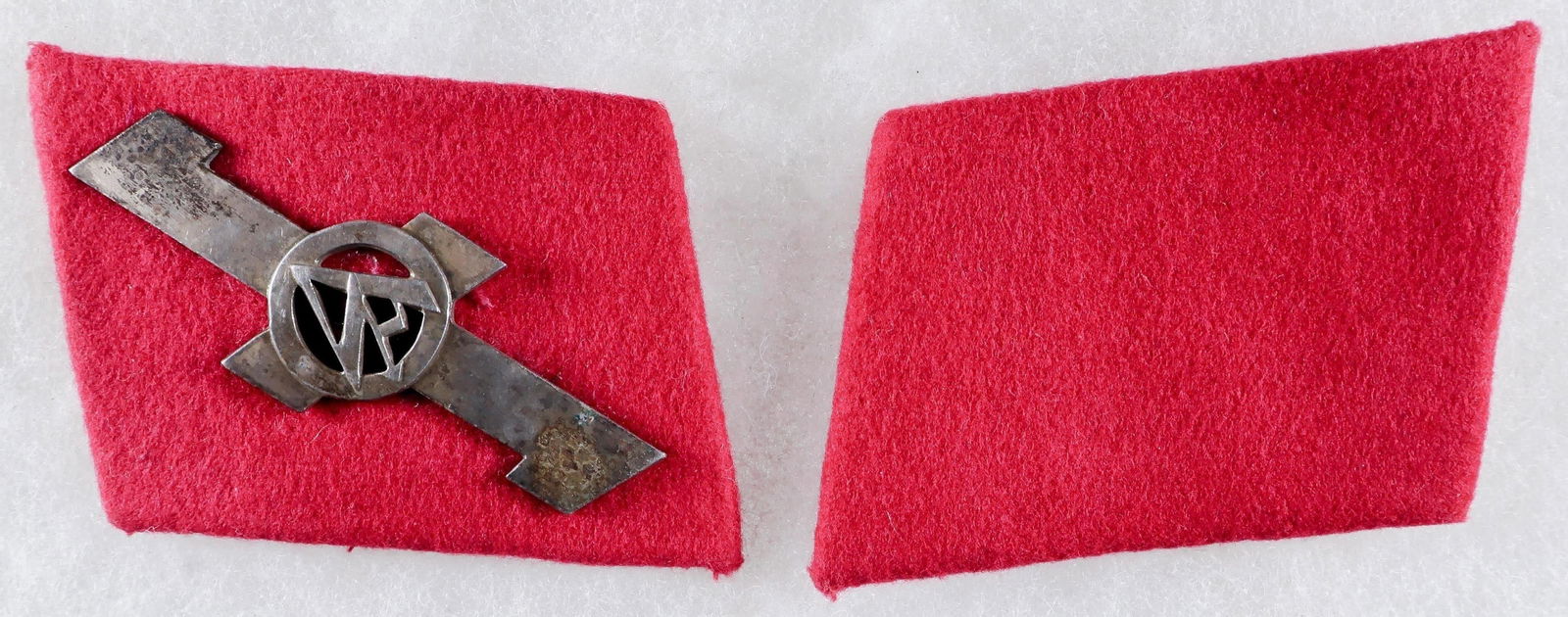 S.A. FELDHERRNHALLE COLLAR TABS: SA Feldherrnhalle Collar Tabs, one bearing a silvered tombak Feldherrnhalle insignia in the form of a Sig rune overlaid by a central Sturmabteilung (SA) logo, the second tab blank. Both are backed