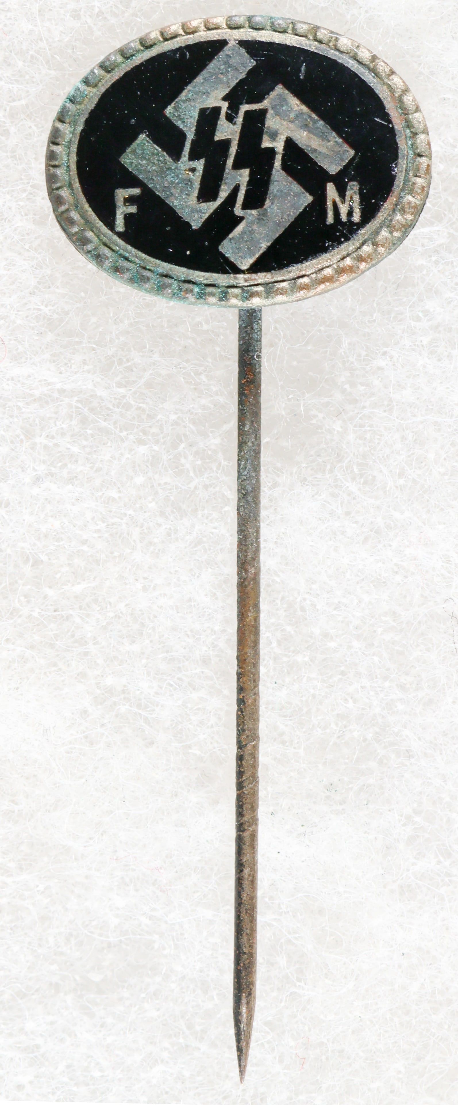 SS FINANCIAL SUPPORT STICK PIN: A small stick pin, .75 x .35 in., given to supporters of the SS who pledge regular monthly donations, with a swastika and SS runes in enamel on front. The reverse is marked: ‘C 31729 GES. GESCH