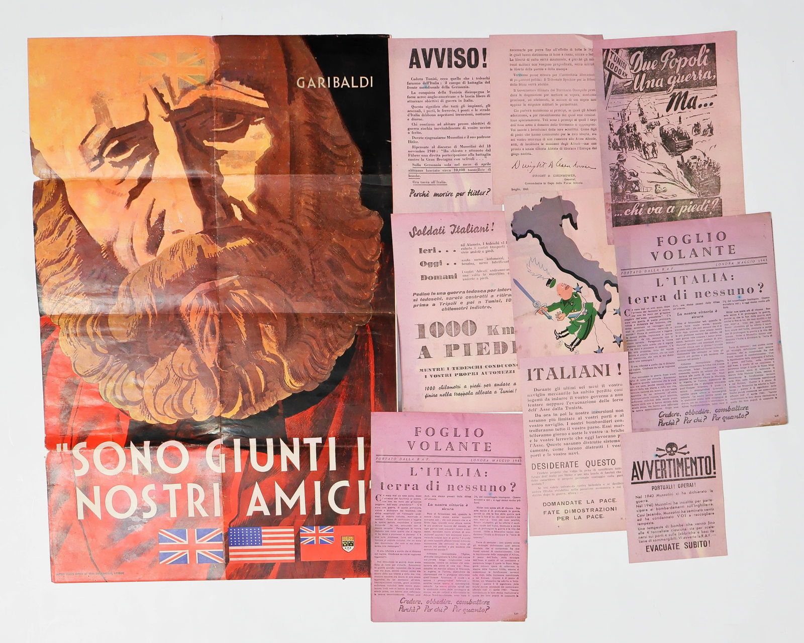 ITALIAN THEATER ANTI-AXIS PROPAGANDA LEAFLETS: A group of nine pieces of World War II Italian anti-Axis leaflets in various sizes ranging from 4 x 5.5 in. to 6.25 x 8.75 in., each printed on pink stock with titled such as ‘Why Die for