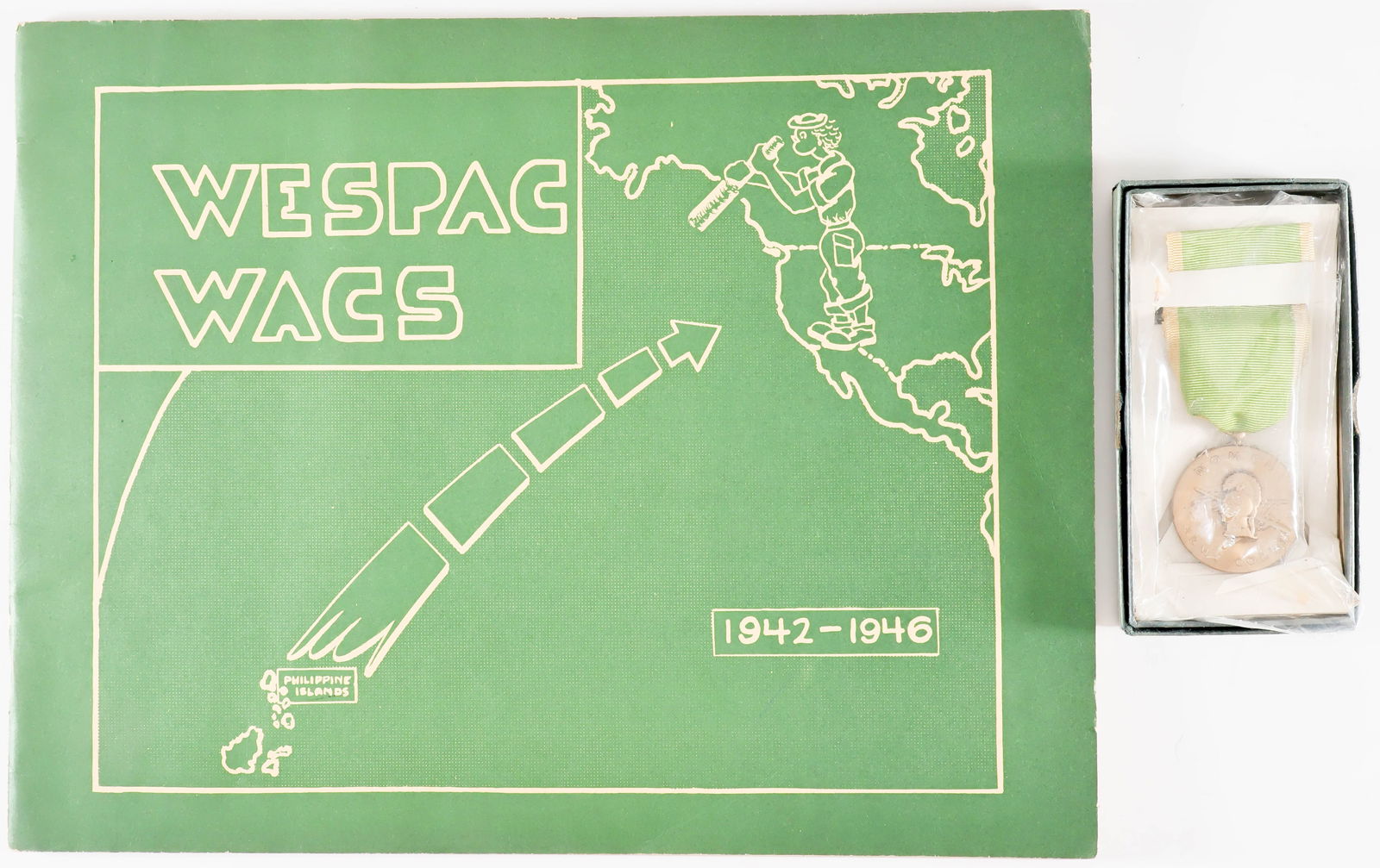 WOMEN’S ARMY CORPS MEDAL AND COMMEMORATIVE BOOK: A fine pair of items related to the Women’s Army Corps of the World War II-era U.S. Army, includes: A Women’s Army Corps Service Medal with ribbon bar, both still sealed in plastic