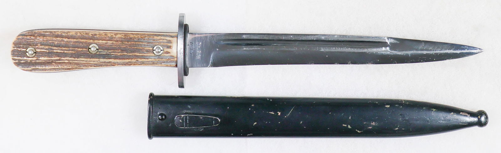 LUFTWAFFE FORESTRY KNIFE: A rare Third Reich Luftwaffe Forestry NCO’S knife, 7.75 in. blade, 12.5 in. overall, featuring heavy staghorn grips secured with three slotted screws, an oval crossguard with a brown leather