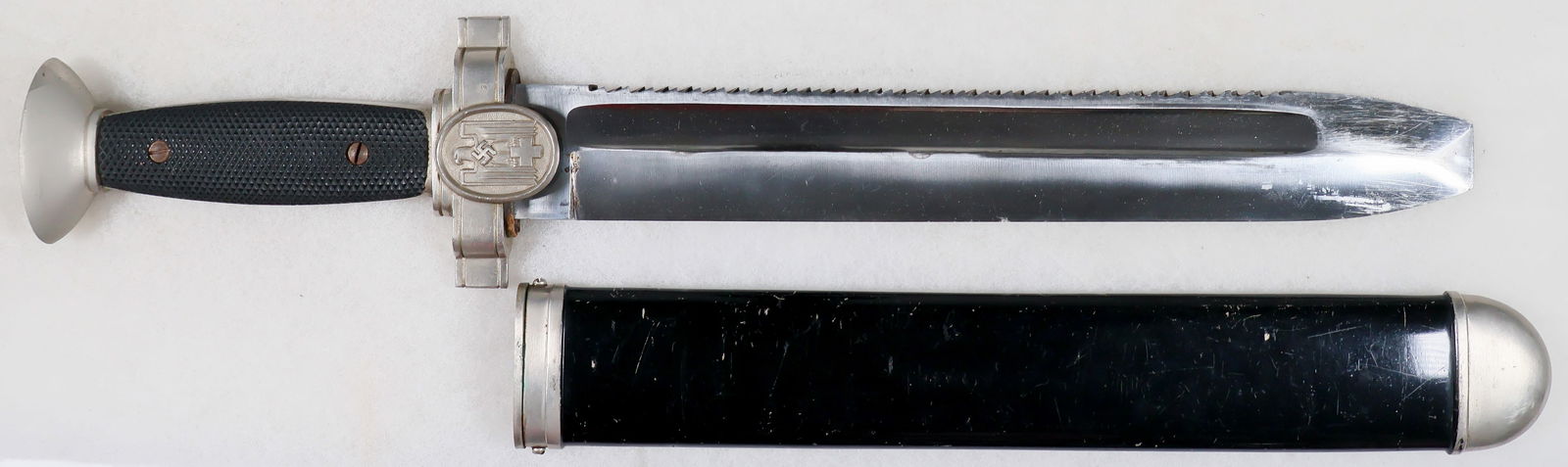 GERMAN RED CROSS HEWER: A nice example of a Deutsche Rotes Kreuz (German Red Cross) hewer, 10.25 in. x 15.5 in., featuring a black checkered Bakelite grip on the obverse and a smooth grip on the reverse, secured by two