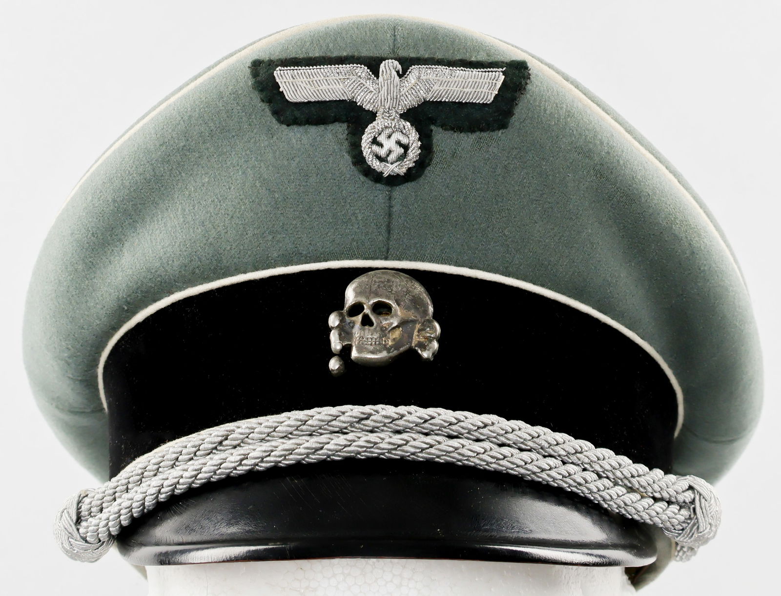 SS/SD POLIZEI OFFICER'S VISOR CAP: Fine example of an SS officer's visor cap, most likely issued to a member of the S.D. or Polizei, constructed of field-grey wool with a black velvet side band, the edges of the band and the crown each