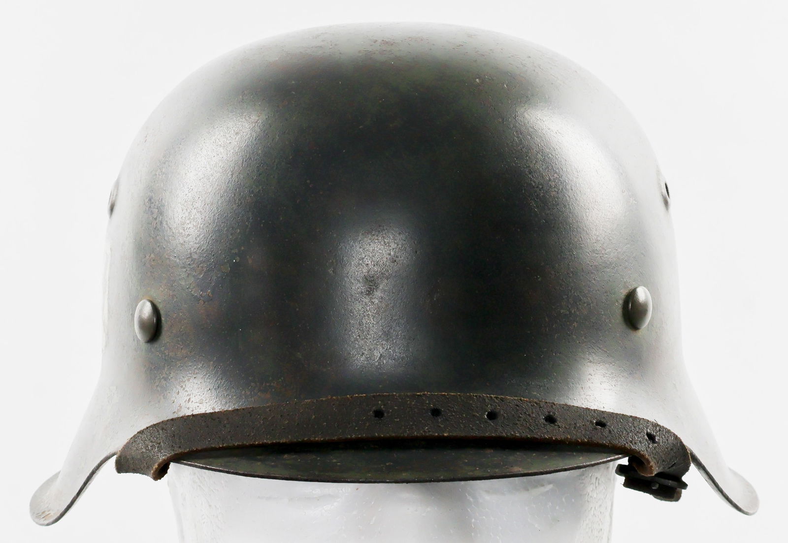 WAFFEN-SS M42 SINGLE DECAL COMBAT HELMET: M42 Waffen-SS single decal combat helmet. Field gray finish lightly faded in places but otherwise completely intact with no scratches, dings or dents. The single silver SS decal bears a substantial