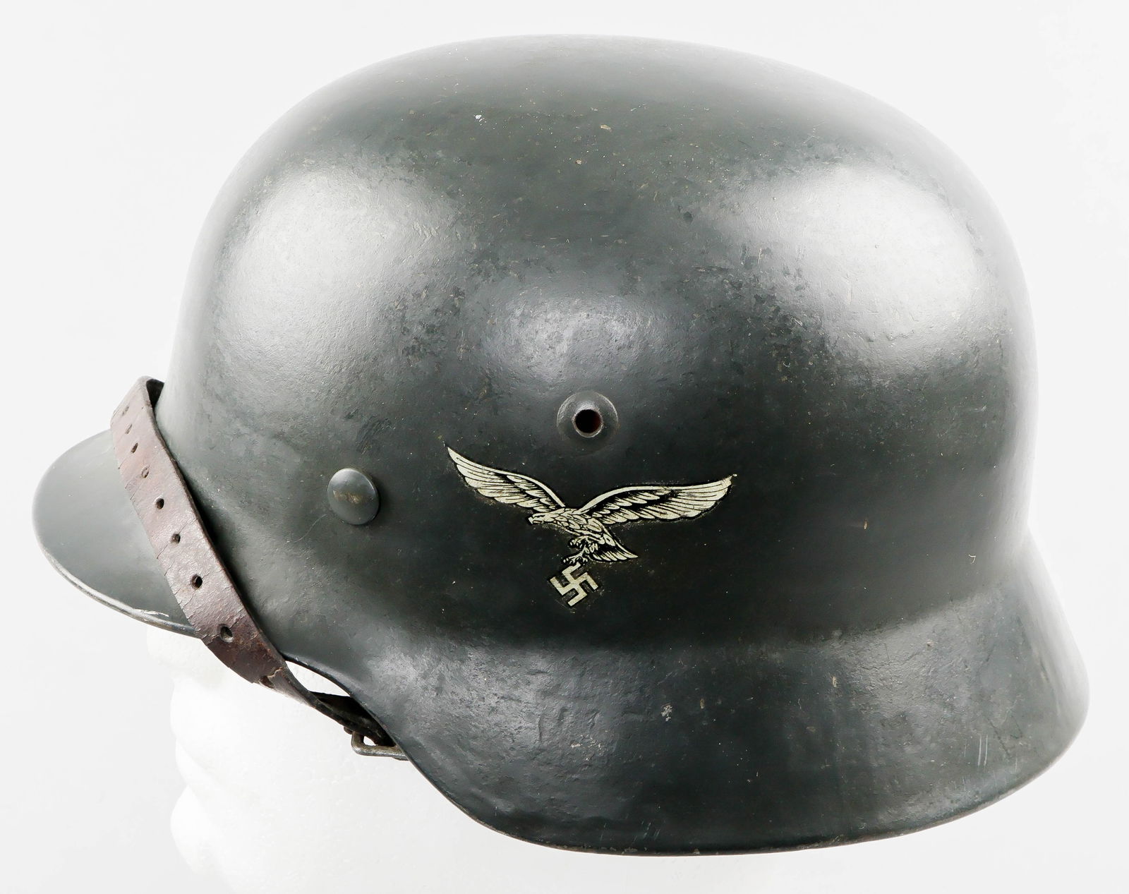 M35 LUFTWAFFE DOUBLE-DECAL HELMET: Superlative M35 Luftwaffe double-decal helmet, very dark green/gray paint in near mint condition, with perfect tricolor national decal on right and an equally fine Luftwaffe decal to the left. Liner