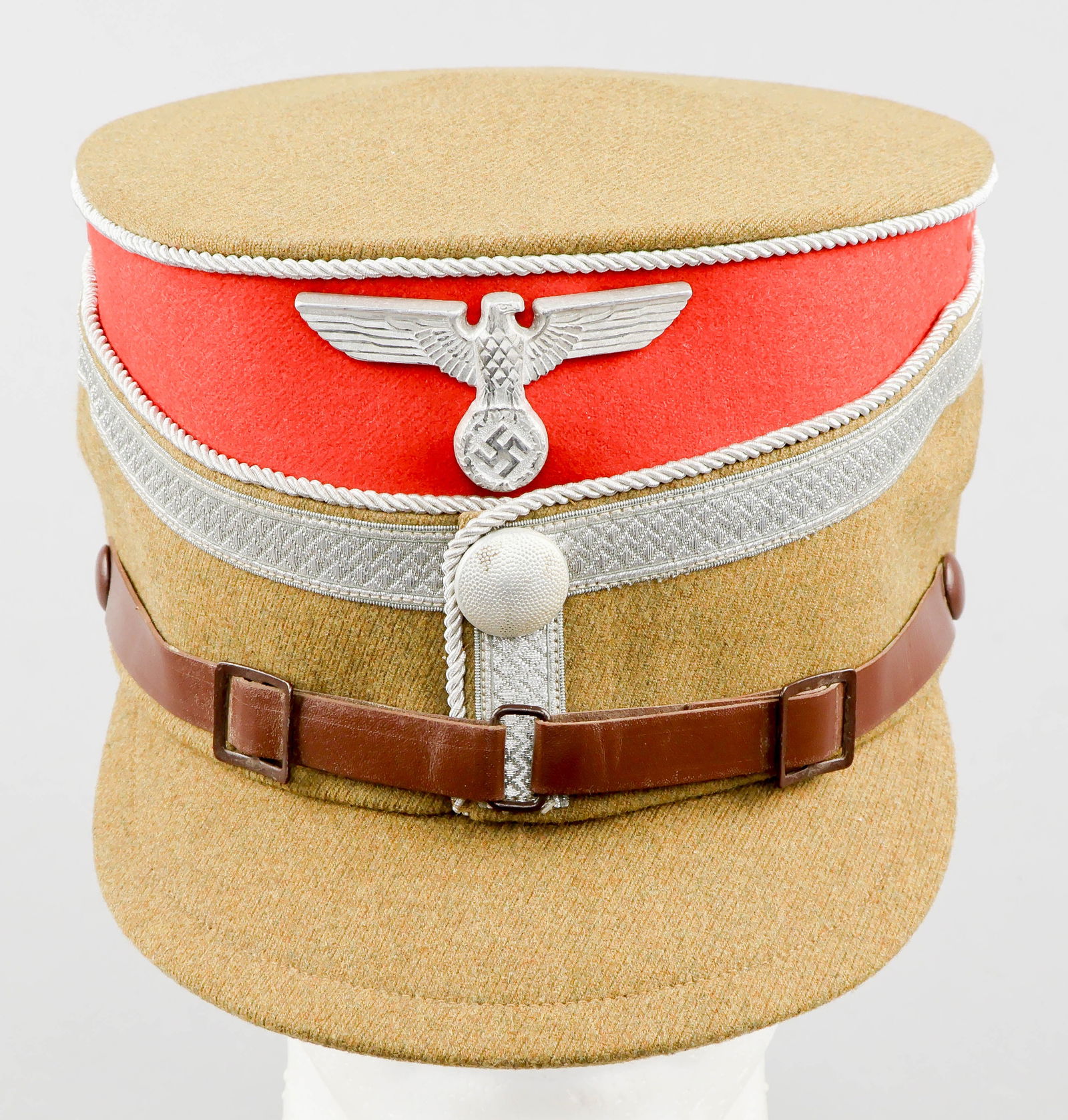 OBERSTE SA-FUHRUNG STAFF OBERFUHRER’S CAP: An extremely rare ‘coffee-can’-style cap or kepi worn by a staff member of the Oberste SA-Fuhrung (OSAF), or SA High Command, holding the rank of Oberfuhrer. The cap is constructed with a