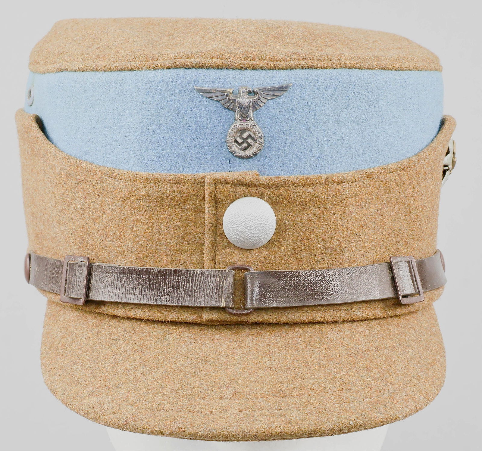 SA-GRUPPE HOCHLAND SERVICE CAP: A very rare Sturmabteilung ‘coffee-can’-style cap or kepi with brown wool crown, sides, and bill, with a light blue wool top beneath the crown, indicative of SA-Gruppe Hochland,