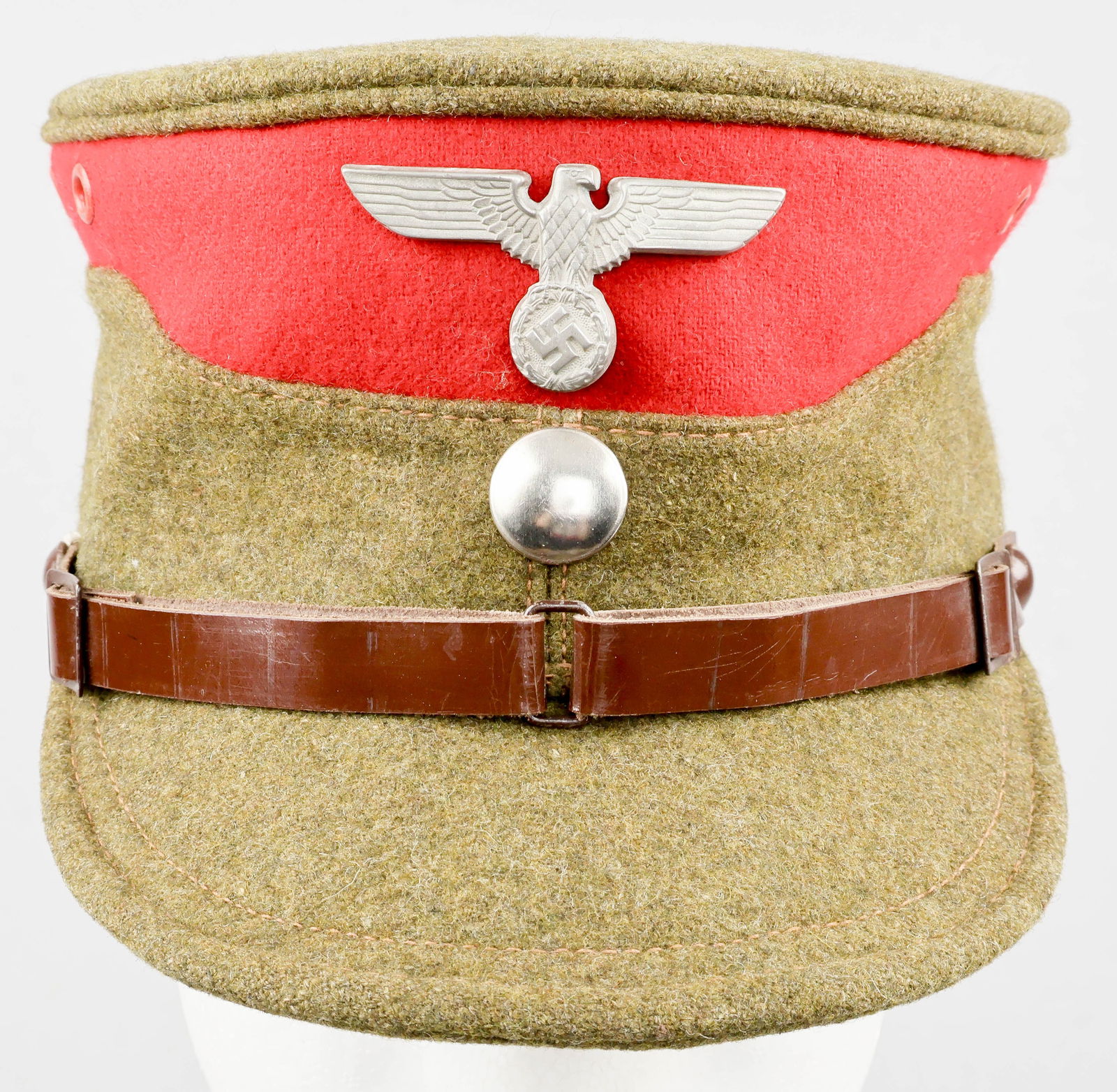 SA-GRUPPE WESTFALEN SERVICE CAP: A very rare Sturmabteilung ‘coffee-can’-style cap or kepi with heavy green-brown wool crown, sides, and bill, with a dark wine-red wool top beneath the crown, indicative of SA-Gruppe