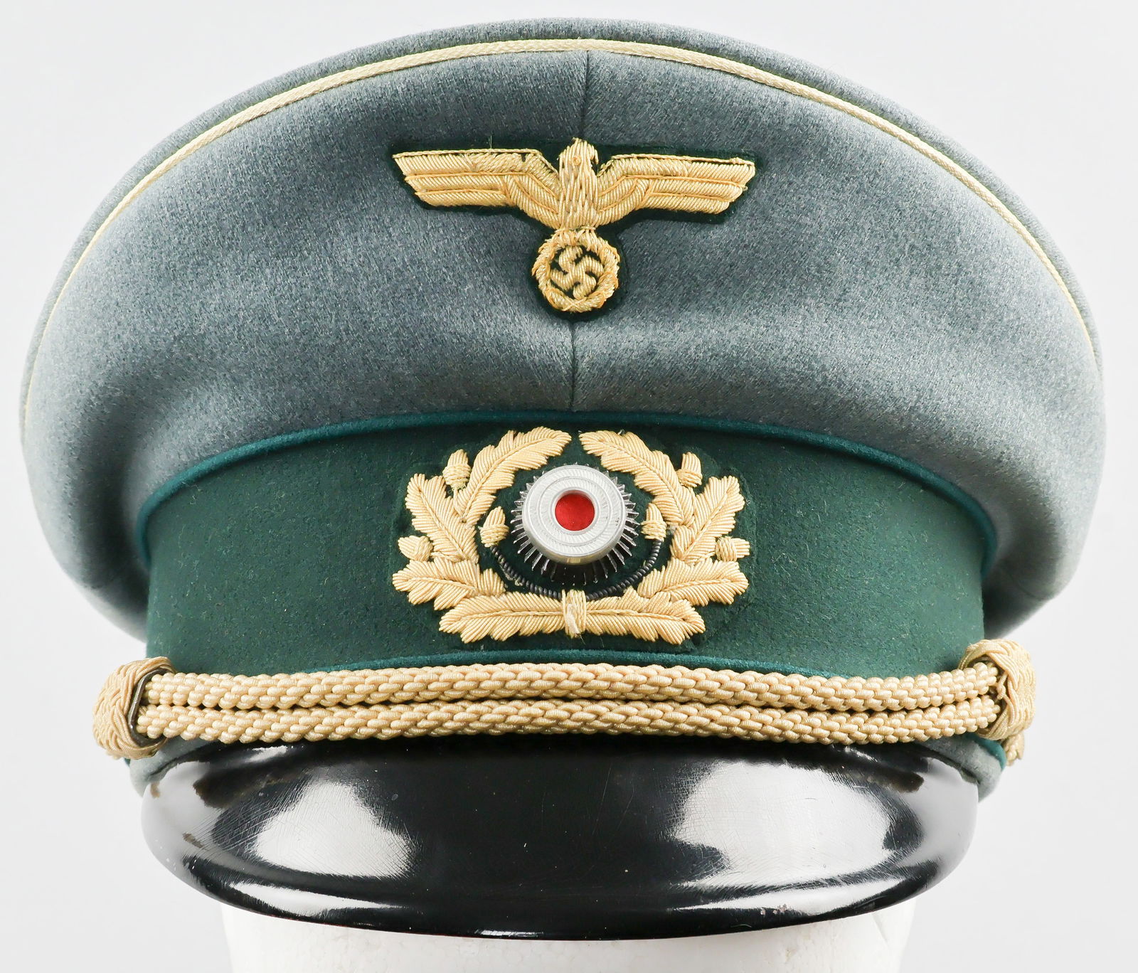 GERMAN ADMINISTRATIVE GENERAL'S VISOR CAP: German administration general's visor cap in near mint condition. The slate grey wool upper with yellow celleon piping is faultless, as is the forest green sideband which is in turn piped in forest