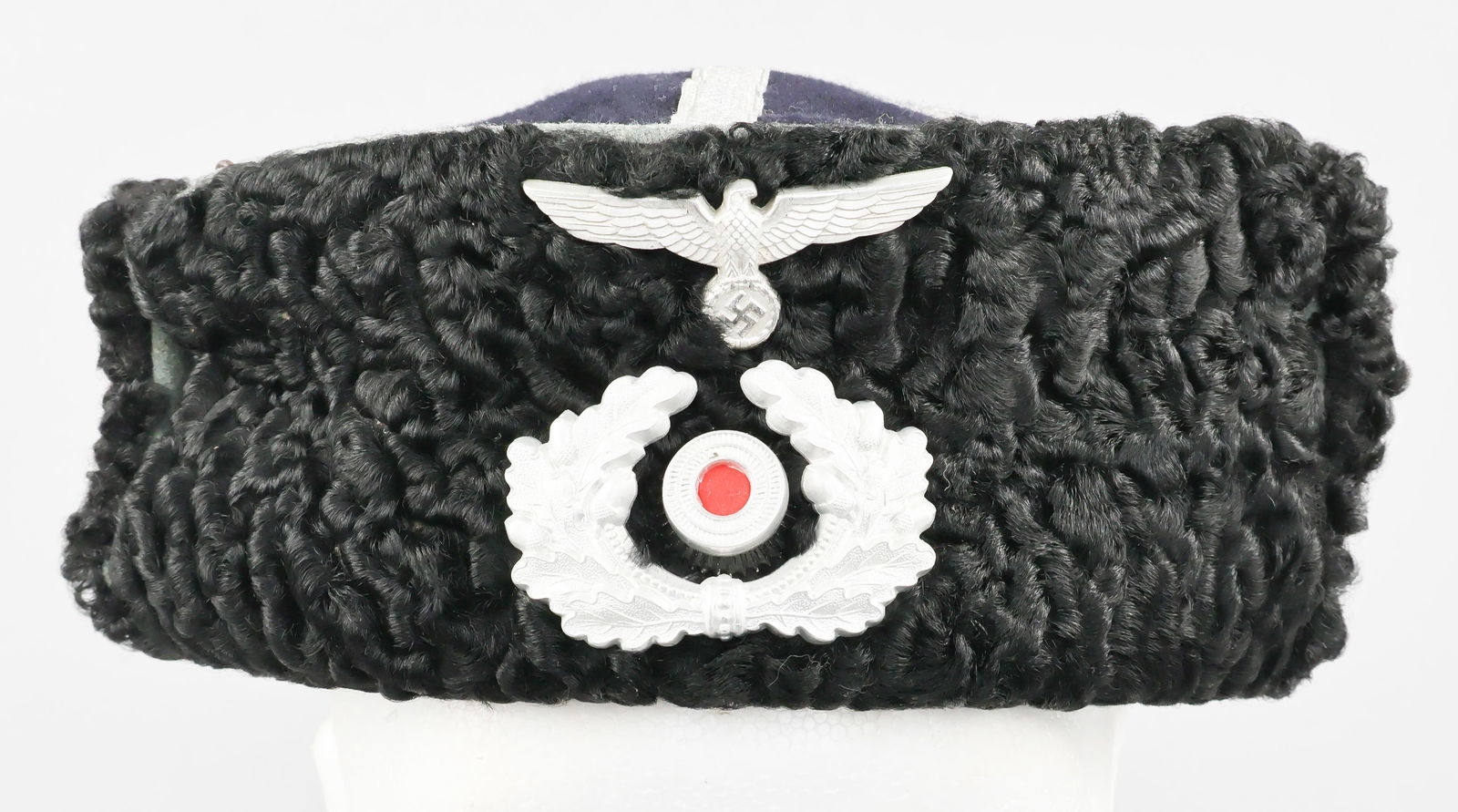 COSSACK SIBERIAN USHANKA CAP: Wool Cossack Siberial ushanka, a winter insulated cap with fold-down ear coverings covered with thick black wool. The cap itself is constructed of feldgrau wool with a black top bearing silver wire