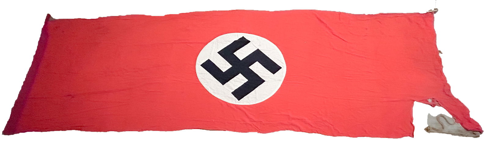 NSDAP VERTICAL BANNER: Large NSDAP vertical cotton banner, 12 ft. x 4.5 ft., quality banner with sewn-in white roundel with printed mobile swastika to the center of each side. The banner bears a large tear near one end,