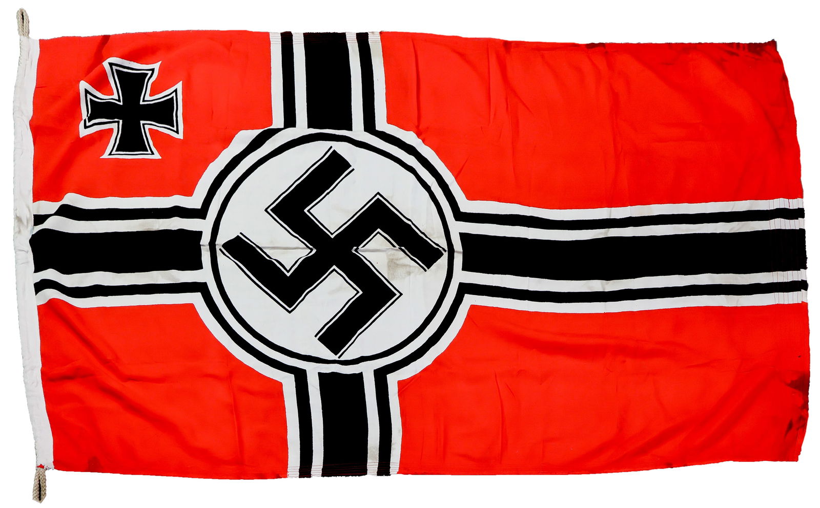 REICHSKRIEGFLAGGE: German Reichskriegsflagge, two-sided and dye-clamped, in a smaller size of approx. 67 in. x 39 in. Flag shows 3 in. x 3 in. sewn-in reinforcement patches, matching red flag material, to both top and
