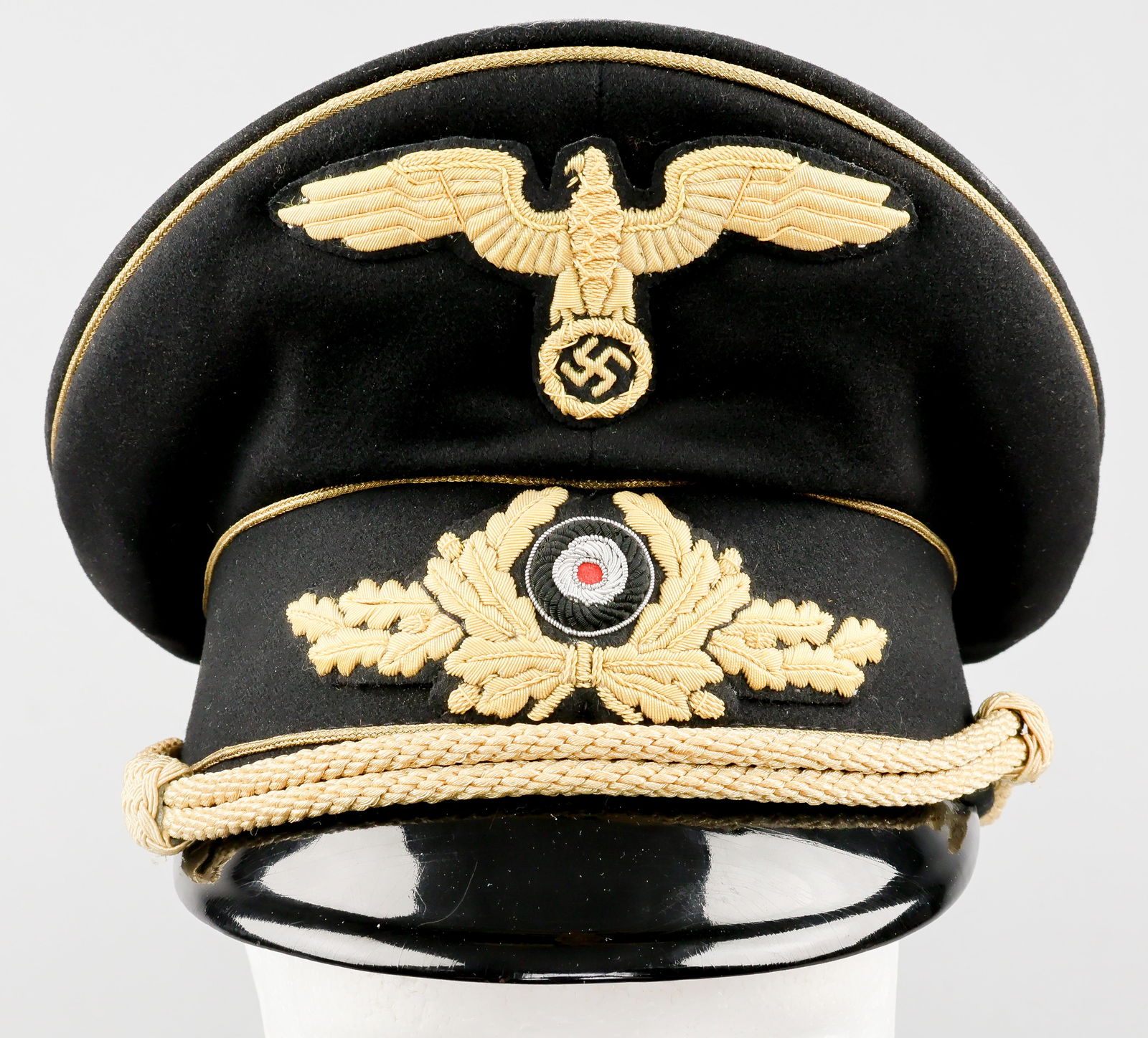 GERMAN AMBASSADOR DR. KURT RIETH’S DIPLOMATIC VISOR CAP: A very rare style of Third Reich headgear, a Diplomatic Officer’s visor cap identified to Dr. KURT RIETH (1881-1969), German ambassador to Austria and envoy to Morocco. The cap is finely