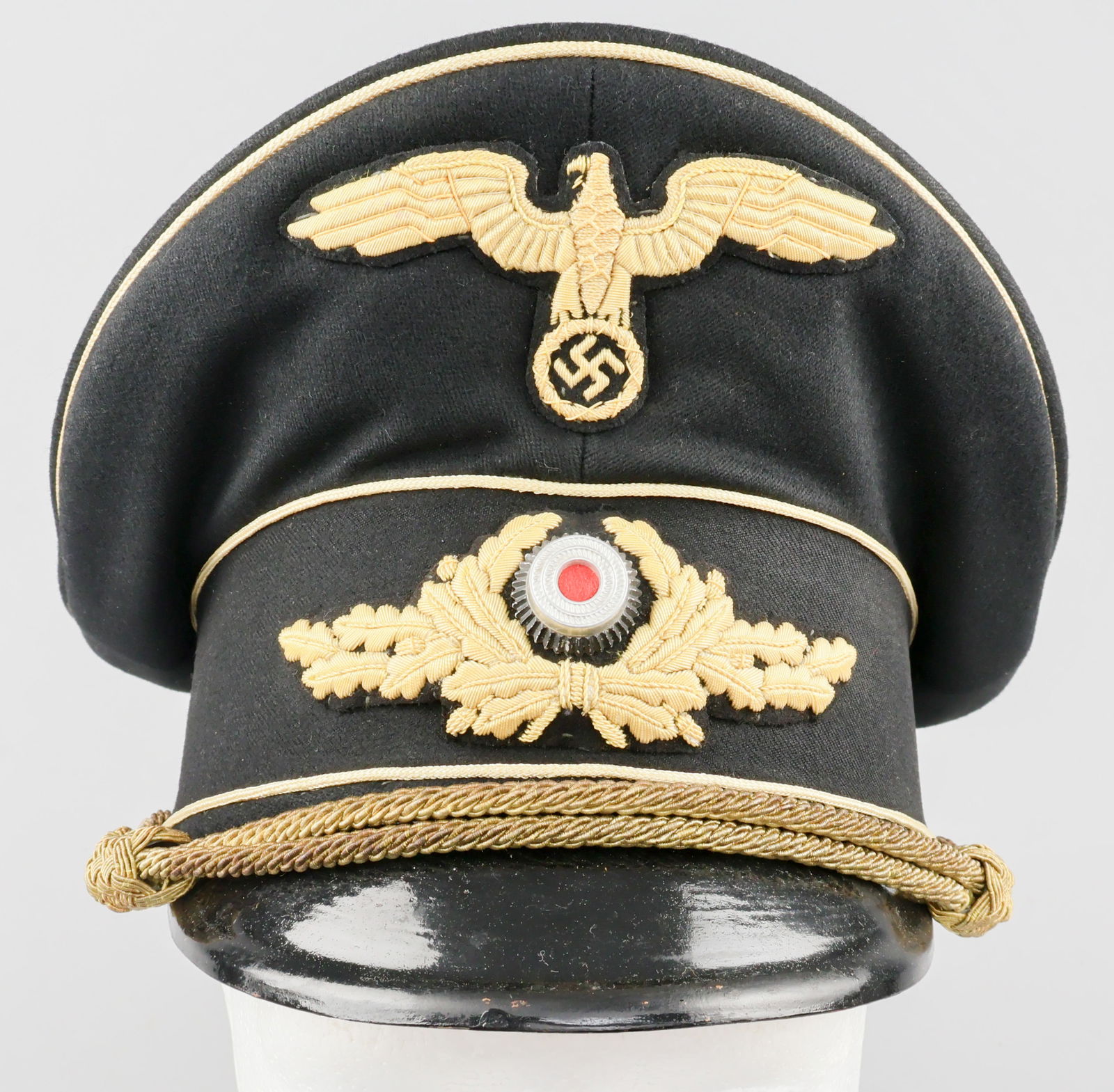 KARL GEORG PFLEIDERER’S DIPLOMATIC VISOR CAP: A very rare style of Third Reich headgear, a Diplomatic Officer’s visor cap identified to career German diplomat and politician KARL GEORG PFLEIDERER (1899-1957). The cap is finely constructed