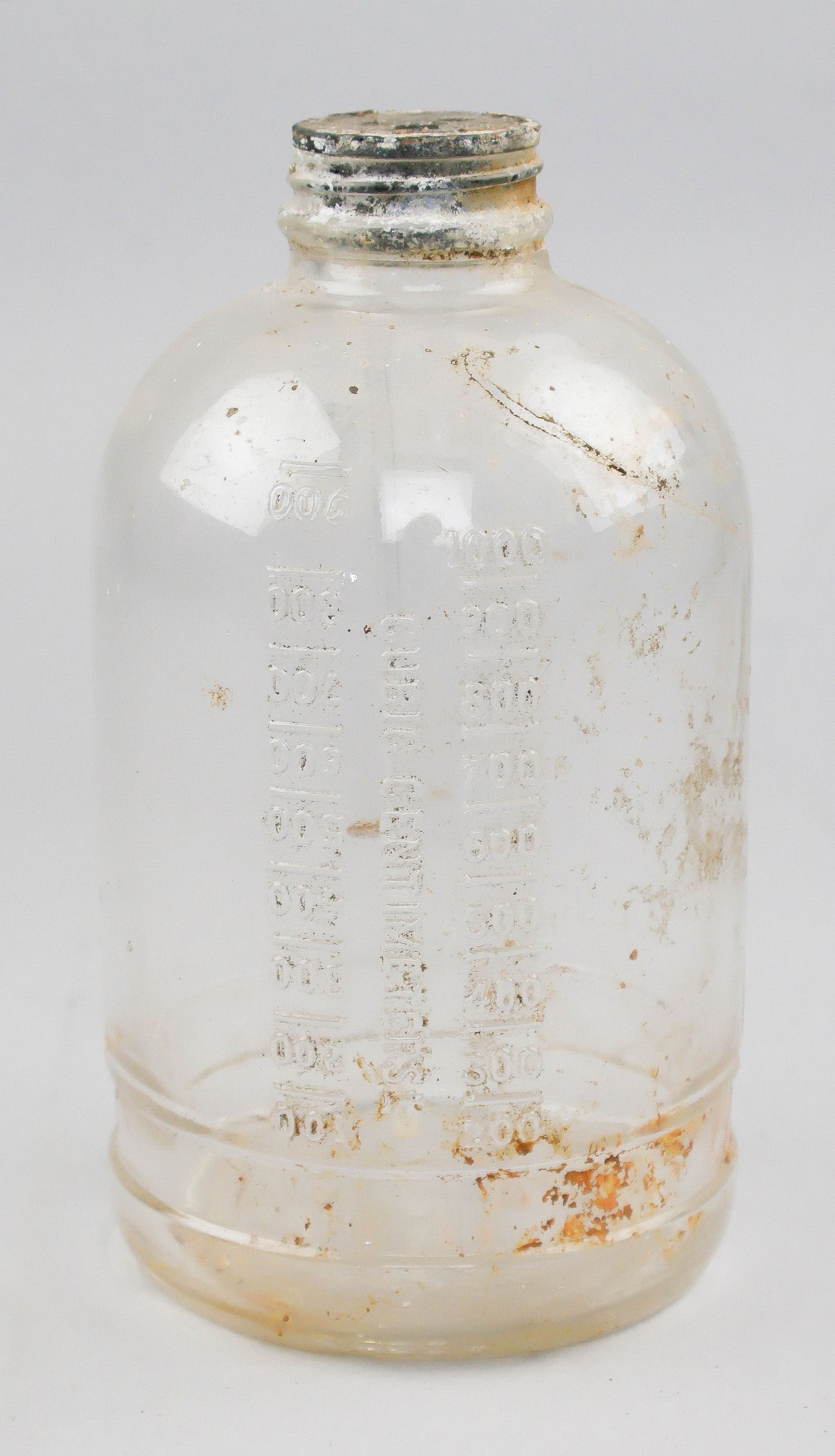(SIEGE OF BASTOGNE) AMERICAN TRANSFUSION BOTTLE: A fine relic recovered from the hospital site of the 326th Airborne Medical Co., 101st Airborne Division near Barriere Hinck in Sainte Ode, Belgium. The unit, which had already served with great