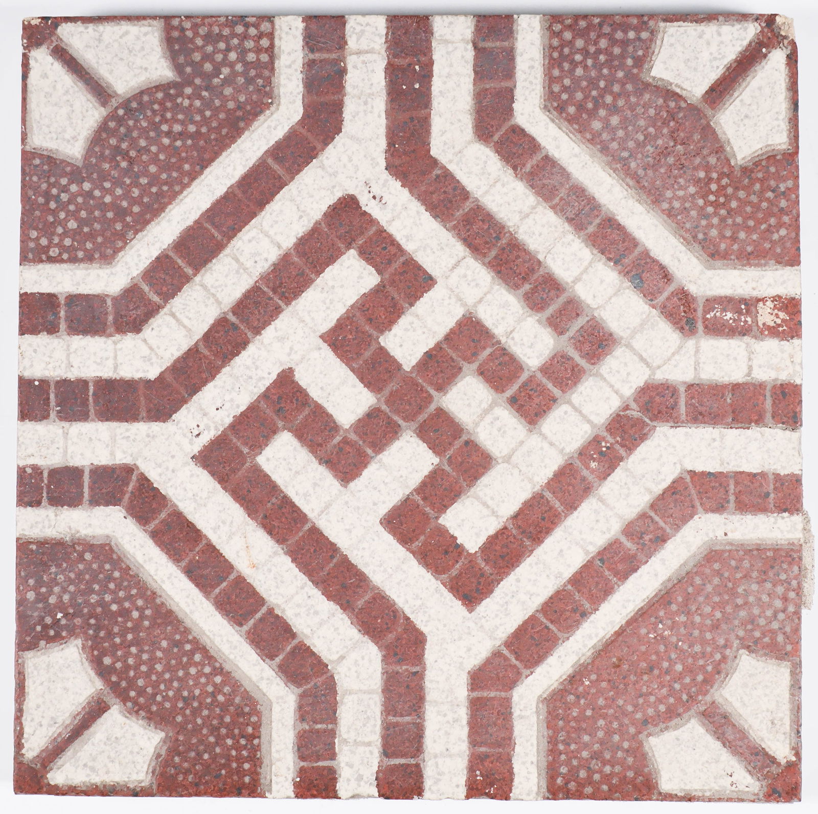 SWASTIKA FLOOR TILE BY VILLEROY & BOCH: Third Reich-era floor tile, 6.5 in. square, depicting a geometric design with a swastika at center. The reverse bears the impressed maker’s name ‘Villeroy & Boch Mettlach’ over the