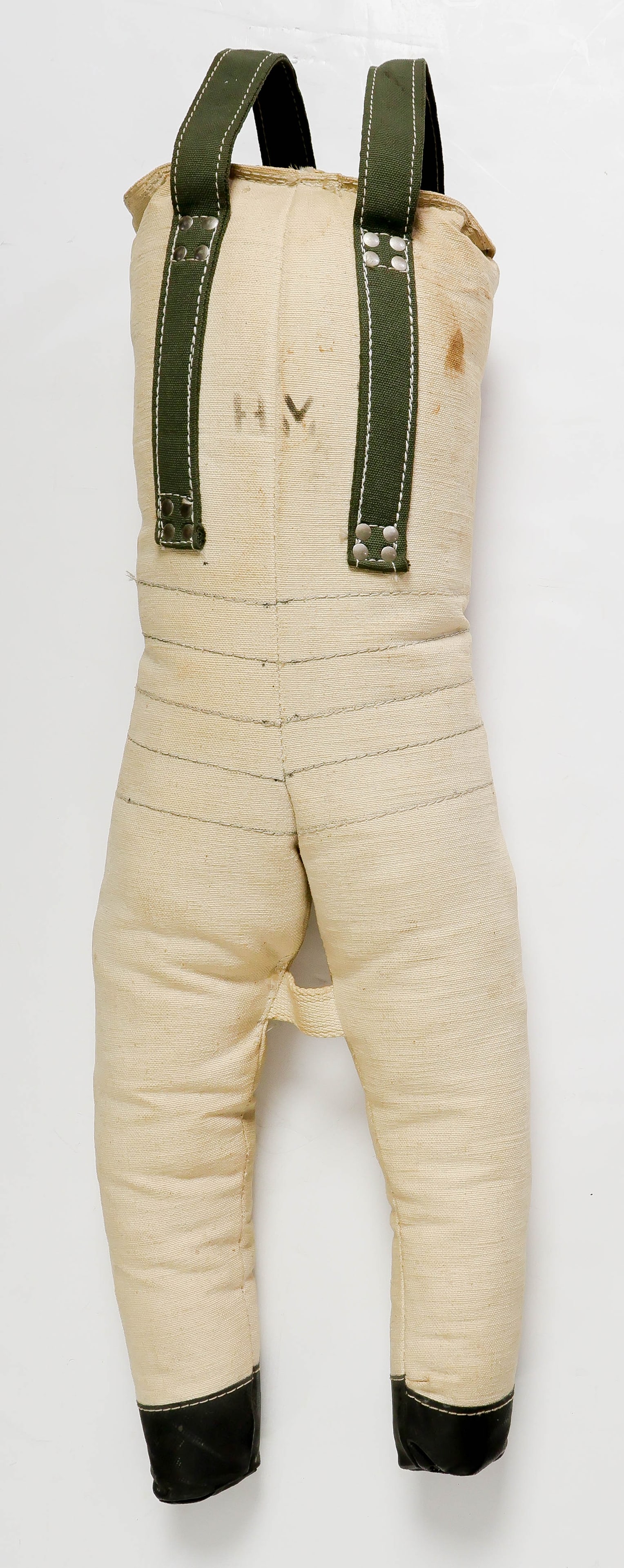 U.S. WORLD WAR II PARACHUTE PRACTICE DUMMY: US Army or US Navy designed parachute dummy, sometimes referred to as a 'Paradummy'. Heavy weighted dummy manufactured from tan canvas with black rubberized canvas accents and closure seam at top,