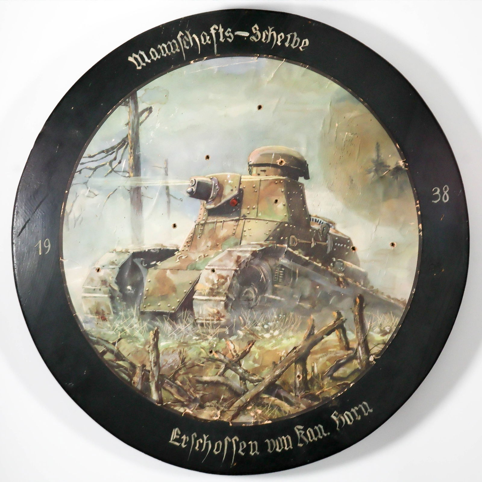 GERMAN MILITARY SHOOTING TARGET: An interesting item, a German military shooting target, solid wood construction with an 18 in. diameter, approx. 1 in. thick. The front of the target bears a fine printed color image of a French