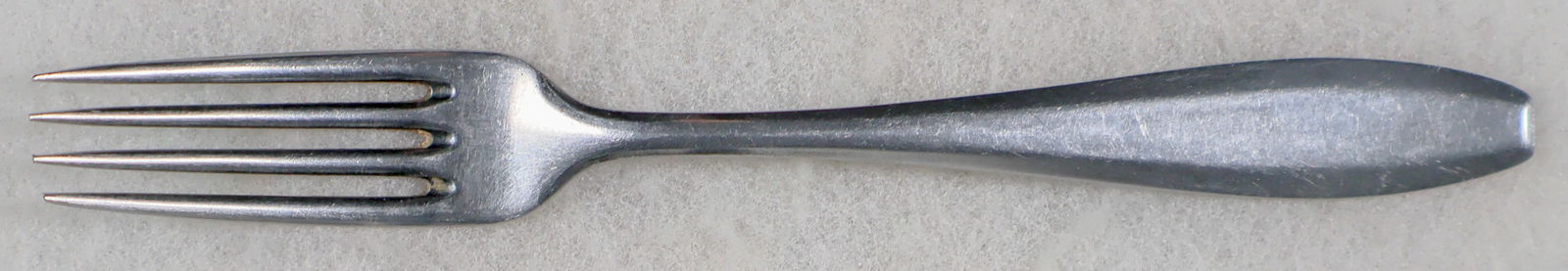 MUNICH REICH'S LEADERSHIP DINNER FORK: Stainless steel dinner fork stamped 'Eingentum der Reichsleitung N.S.D.A.P. Munchen', 8.25 in., also hallmarked 'Original Olympia', and maker marked for Oxydex Rostfrei. Likely used in a government