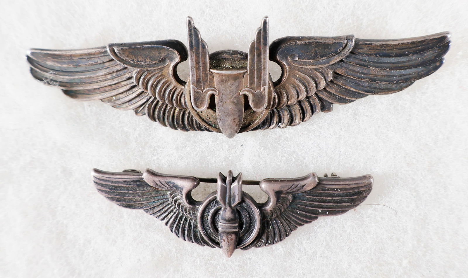 ALLIED BOMBER GROUPING (5): Group of five items, includes two U.S. Aerial Gunner Badges, the first 3 in. long, in sterling by Balfour, clutch back, the name 'Hall' scratched on reverse, the second pin also sterling, 2 in. long,