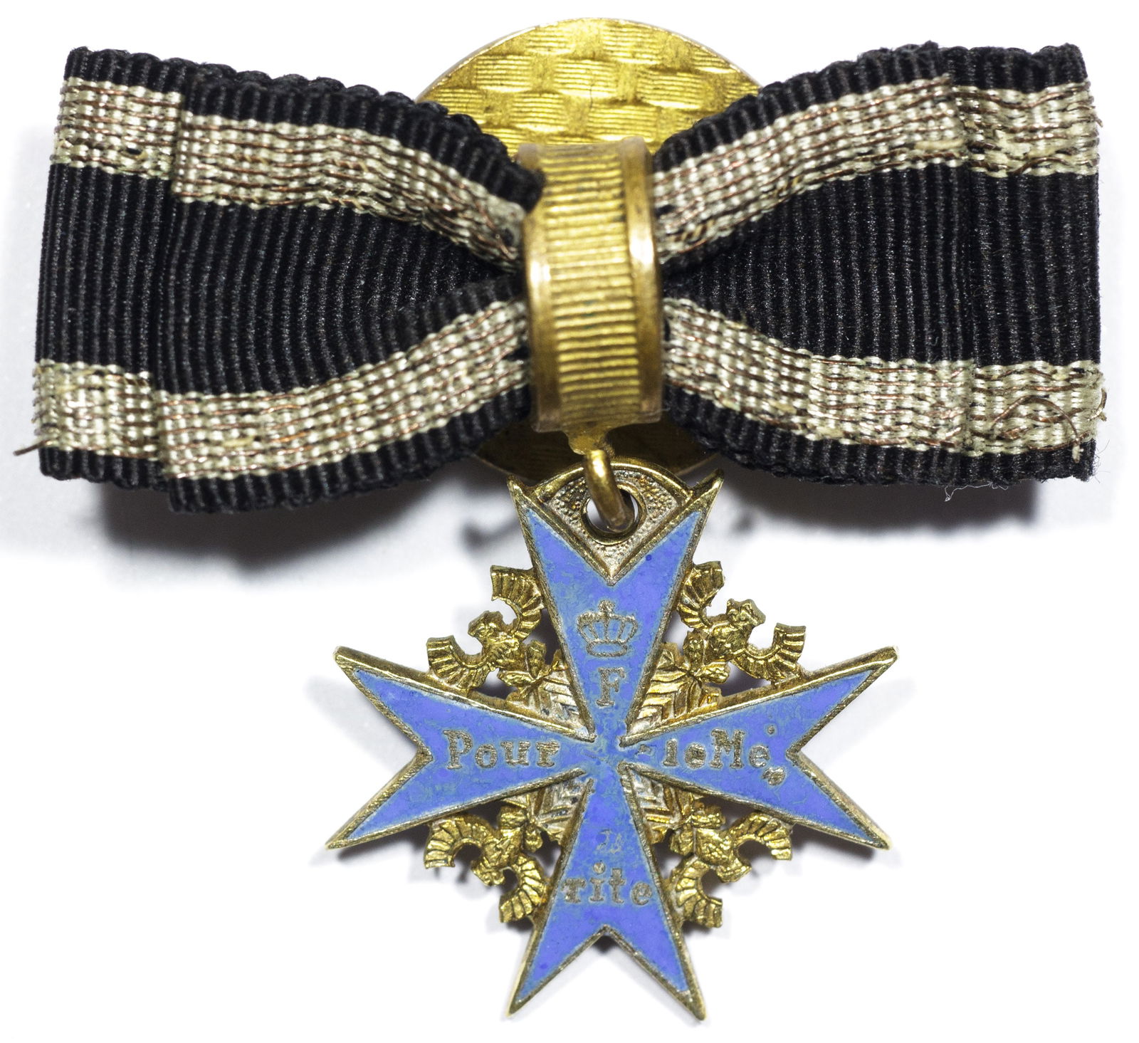 MINIATURE POUR LE MERITE BOUTONNIERE: A fine example of a miniature World War I-era Imperial German award, the Pour Le Merite, also known as Blue Max, the highest award granted for military merit. The miniature medal itself, 0.75 in.