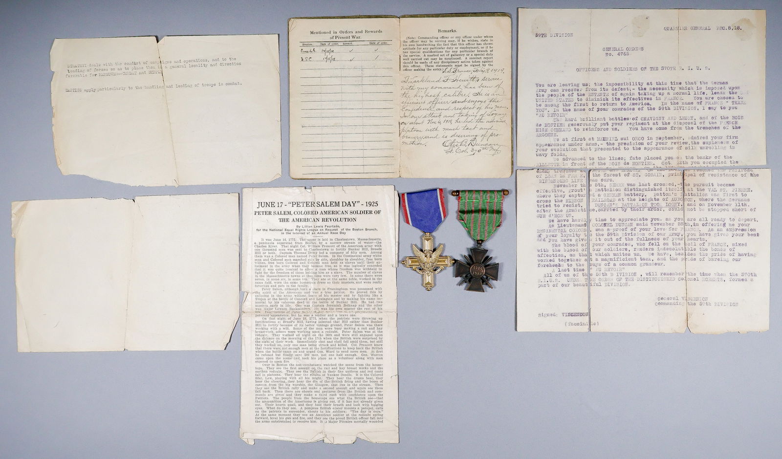 CROIX DE GUERRE AND DSC OF A WORLD WAR I BLACK SOLDIER: Two medals, the Croix de Guerre and Distinguished Service Cross, issued to Larland F. Hewitt, Second Lieutenant in the 370th U.S. Infantry, 59th Division. According to his Officer’s Service