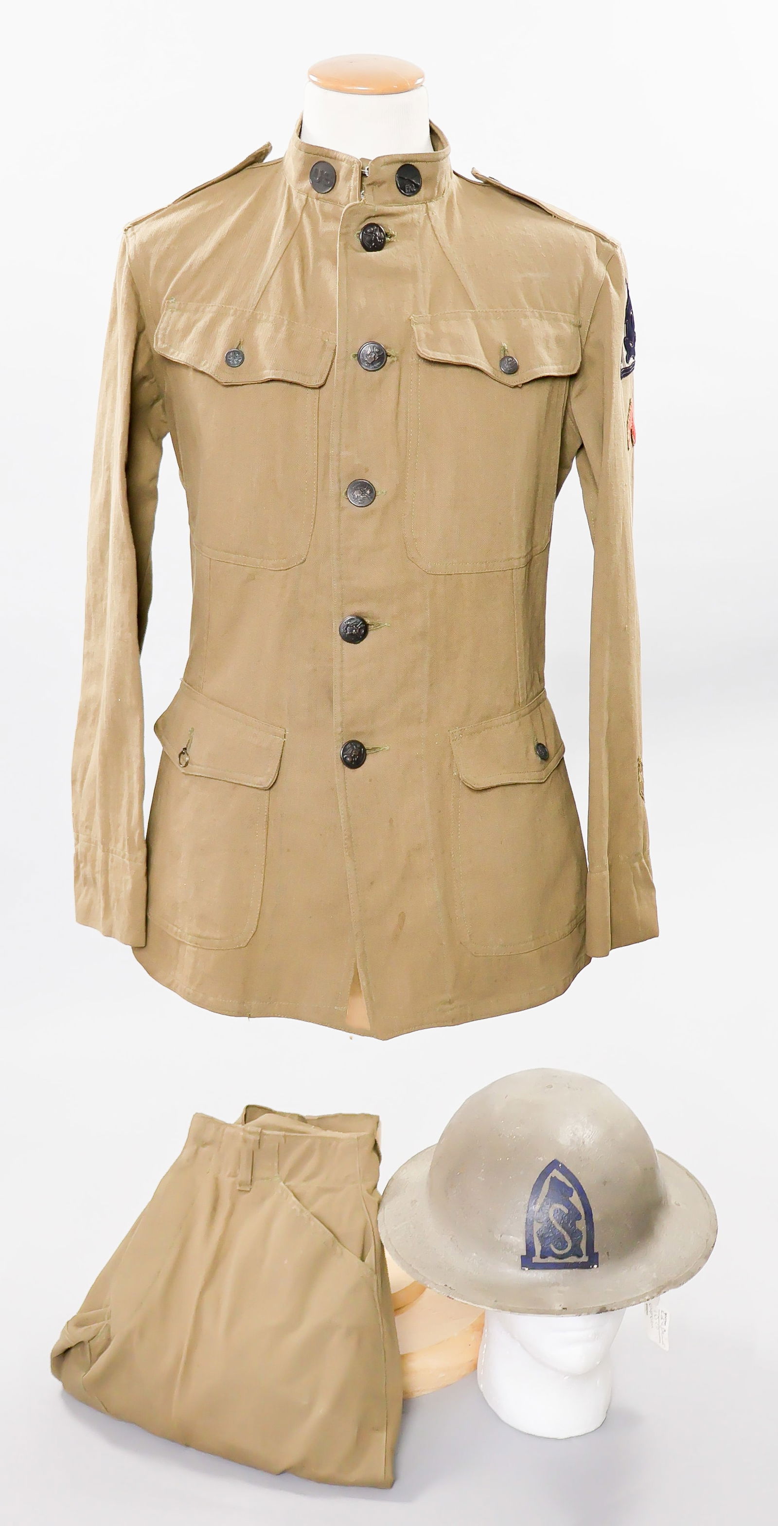 NAMED 27TH INFANTRY REGIMENT ‘SIBERIA’ HELMET AND UNIFORM: A very fine uniform grouping related to the U.S. Army’s 27th Infantry Regiment, best known for its service with the American Expeditionary Force sent to Siberia from 1918 to 1920 during the Russ