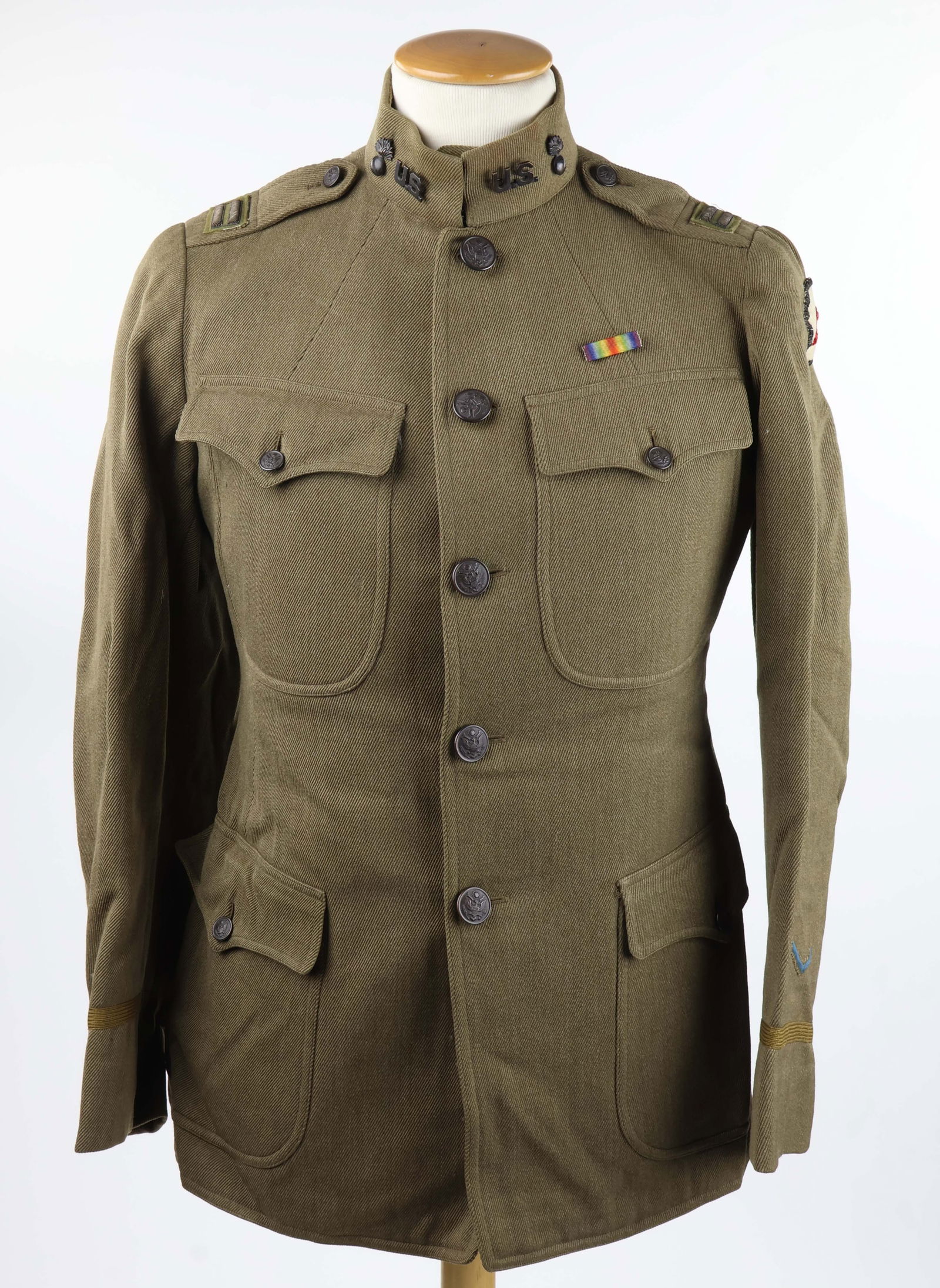 WORLD WAR I U.S. ORDNANCE CORPS CAPTAIN'S TUNIC: World War I U.S. Ordnance Corps captain's tunic, heavy green wool gabardine with four scalloped pockets, bullion captain's bars on shoulder straps, 37th Infantry Brigade shoulder patch, World War I Vi