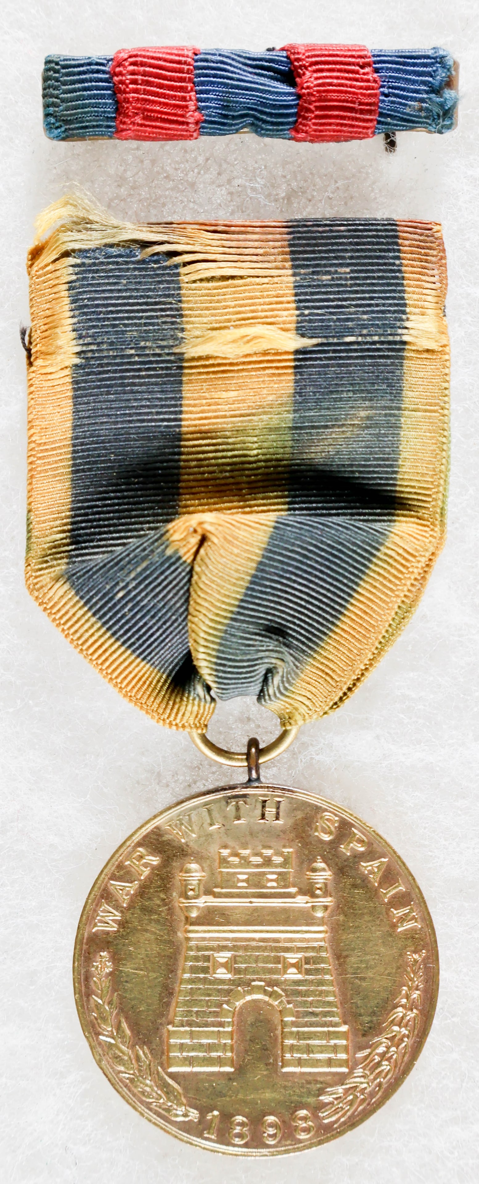 BLACK 24TH INFANTRY REGIMENT SERGEANT’S SPANISH CAMPAIGN MEDAL AND PHILIPPINE CAMPAIGN RIBBON: A very fine set of two decorations, the first a U.S. Army Spanish Campaign Medal, awarded to soldiers who took part in the Spanish-American War in 1898. The obverse of the medal depicts a