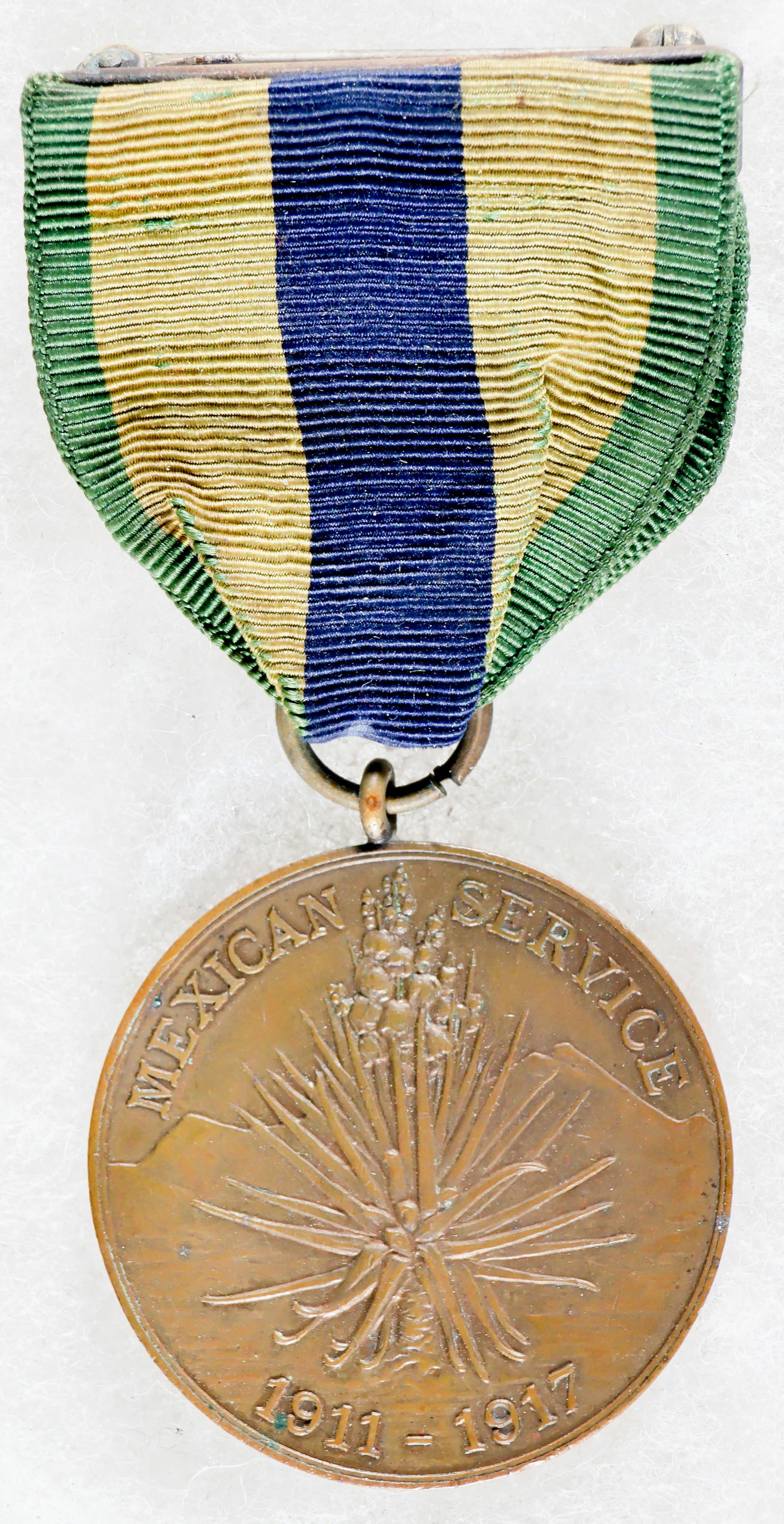 BLACK 24TH INFANTRY REGIMENT SOLDIER’S MEXICAN SERVICE MEDAL: A fine, identified U.S. Army Mexican Service Medal, awarded to personnel who participated in combat operations against Mexican forces between 1911 and 1919. The obverse of the medal depicts a yucca