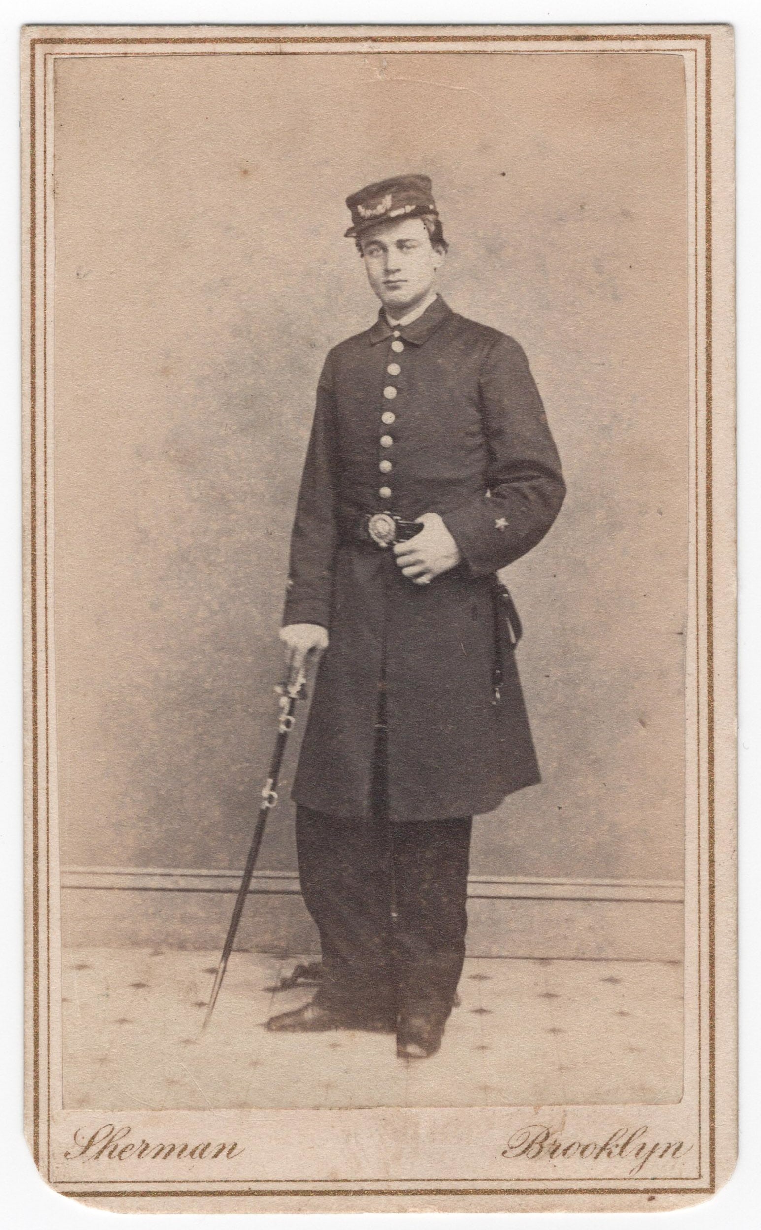 (UNION NAVY) USS JUNIPER MASTER’S MATE PETER M. BEAM SIGNED CARTE DE VISITE: A fine signed and inscribed carte de visite photograph, 2.5 x 4 in. sepia, a full-length view of U.S. Navy officer PETER M. BEAM in uniform, with his dress sword in hand. On the verso, Beam signs in b
