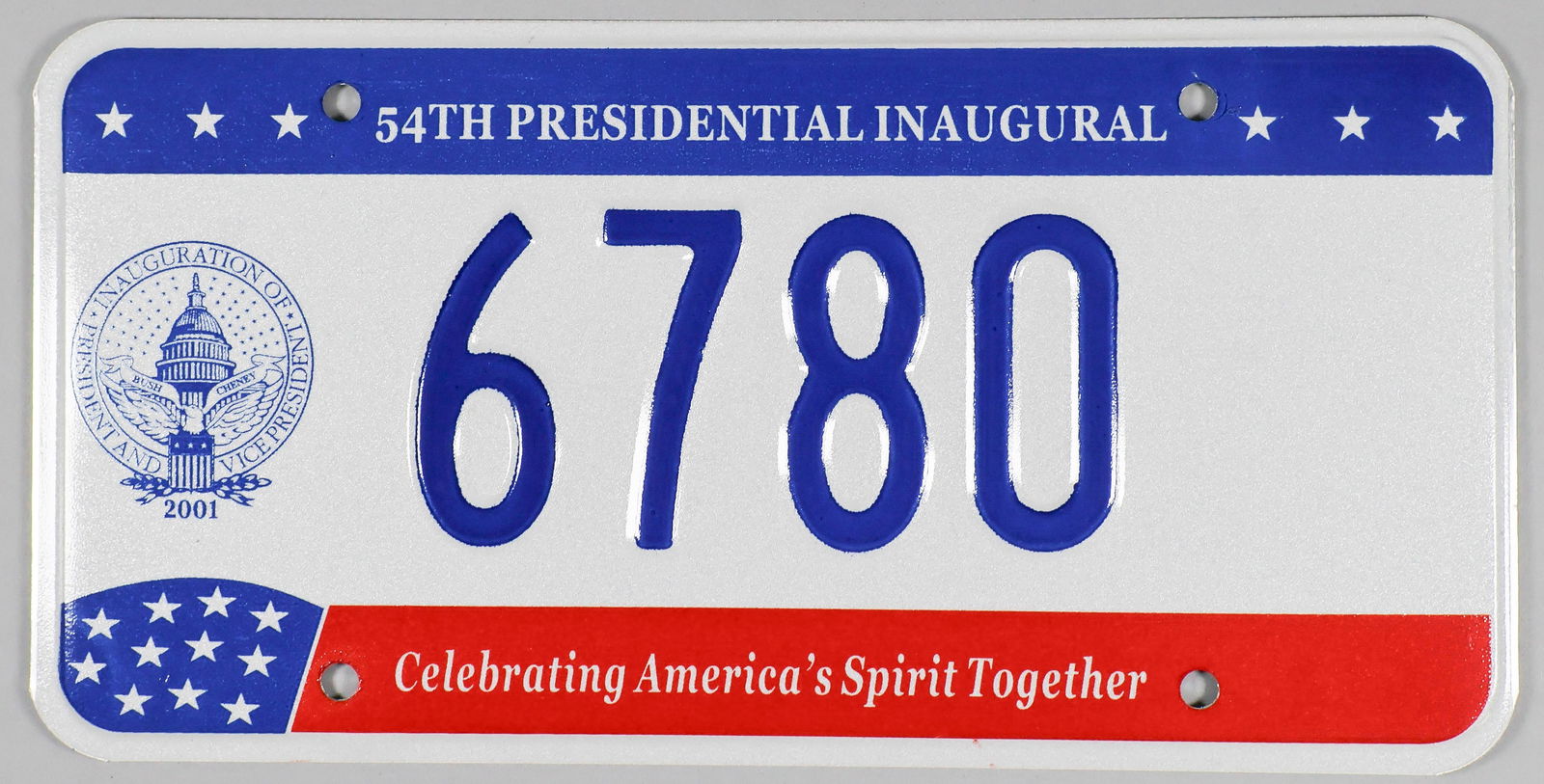 GEORGE W. BUSH INAUGURAL LICENSE PLATE: Standard size steel license plate issued in honor of the 2001 inauguration of President George W. Bush. The plate could be legally registered and used on a vehicle until the April 15th following
