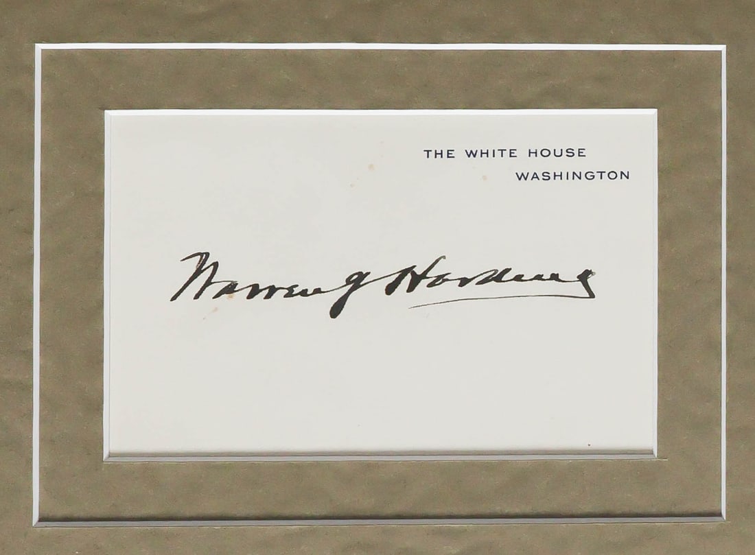 WARREN G. HARDING: (1865 - 1923) Twenty-ninth President of the United States. Full, very bold signature as president on a White House card. Very fine. Matted with a 7 x 9.5 in. (sight) sepia profile portrait by Harris