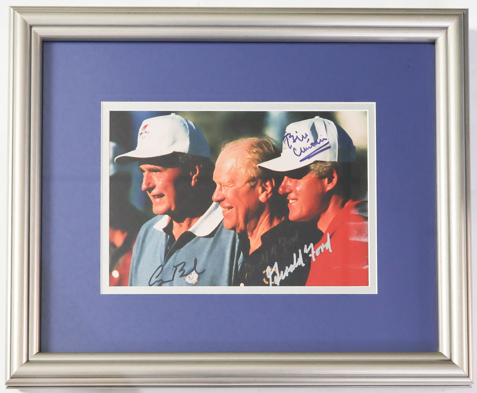 THREE PRESIDENTS SIGNED PHOTOGRAPH: Attractive color photograph. 9.25 X 6.5 in. (sight), color, depicts presidents GEORGE H. BUSH, GERALD R. FORD and WILLIAM J. CLINTON in casual, chest-up poses during a golf outing, each signing