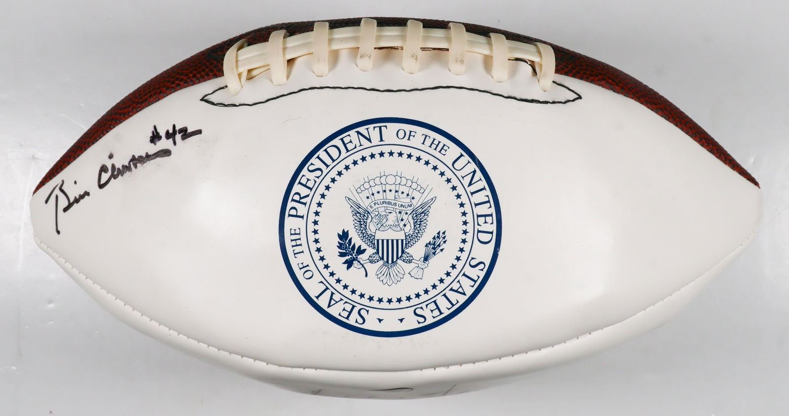 WILSON 'PRESIDENTIAL' FOOTBALL SIGNED BY BILL CLINTON AND JIMMY CARTER: Very rare Wilson white and brown 'Presidential' leather football, three white panels and one textured brown leather panel, one panel each signed by 39th U.S. President JAMES E. CARTER: 'J. Carter
