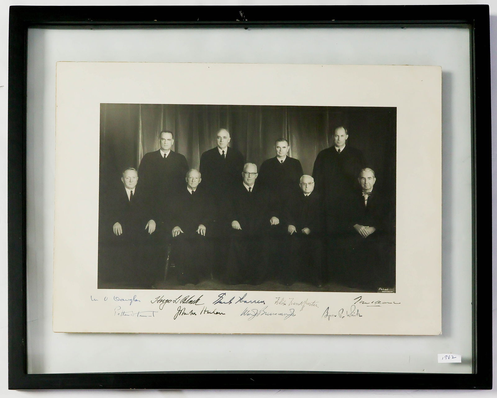 1962 EARL WARREN U.S. SUPREME COURT: Very desirable signed formal photograph of the entire Earl Warren U.S. Supreme Court, ca. 1962, one of the most influential court in the country's history whose Brown vs. Topeka Board of Education