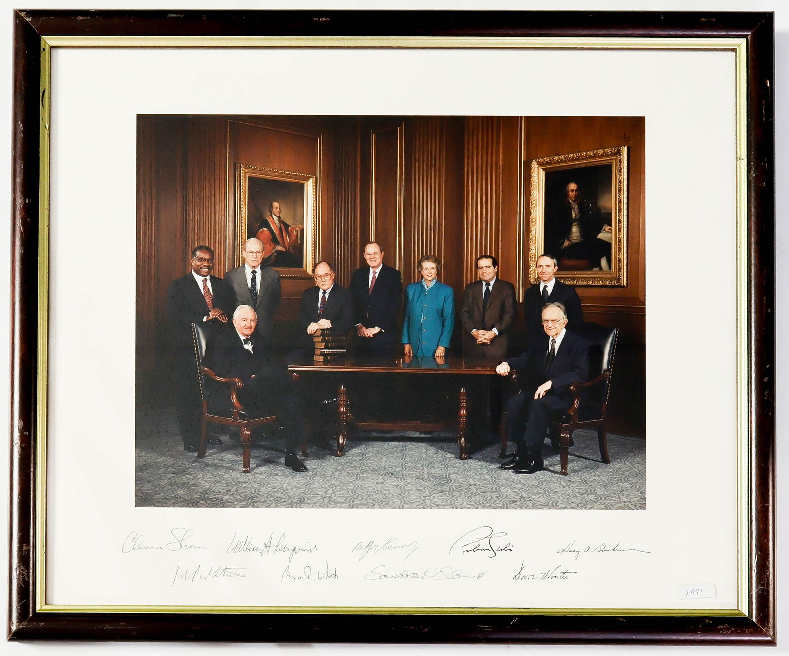 1991 WILLIAM H. REHNQUIST U.S. SUPREME COURT: Terrific signed informal photograph of the entire William H. Rehnquist U.S. Supreme Court, ca. 1991. The 19 x 15.5 in. (overall) color image is signed on the mount by the nine members of the court, ge