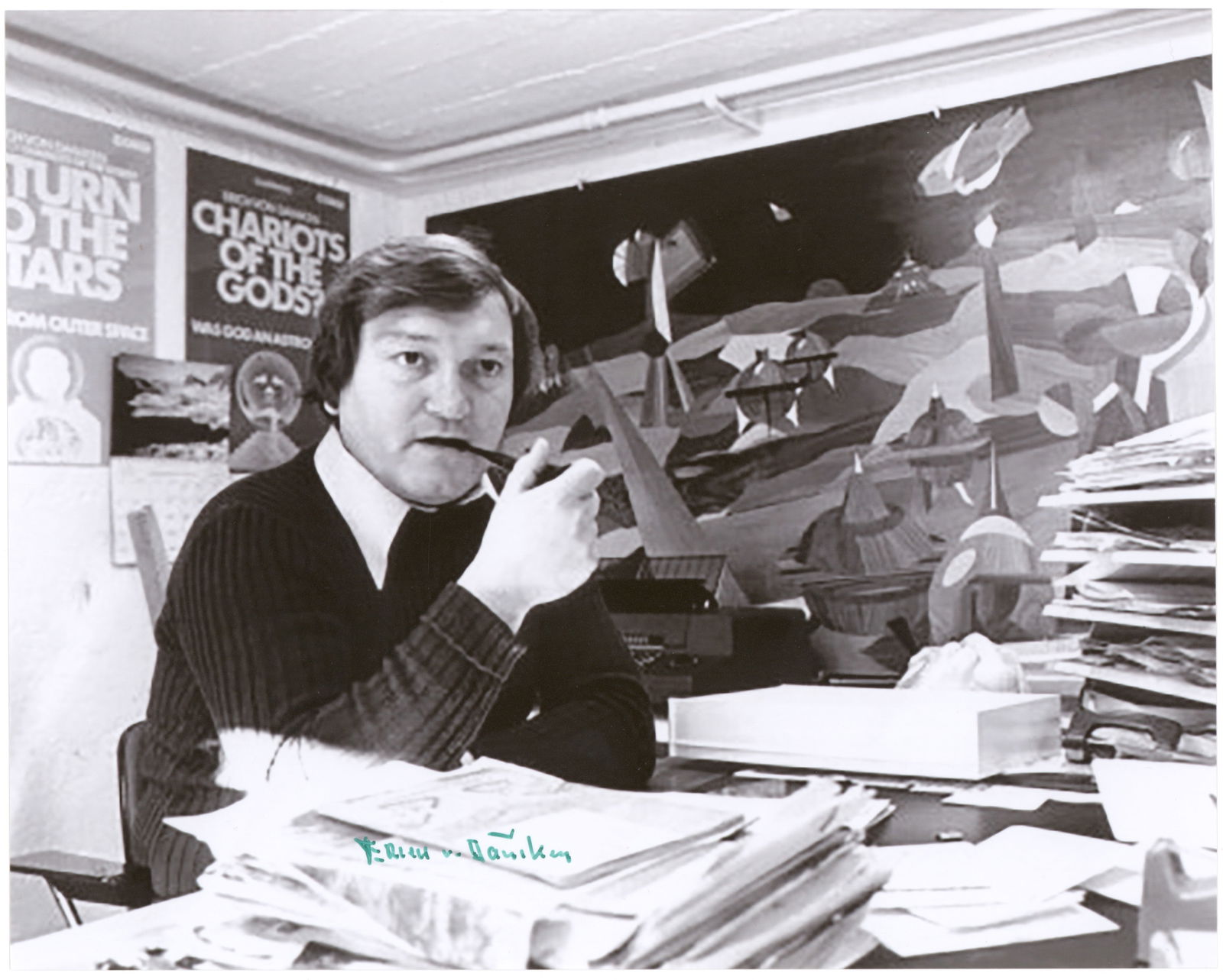 ERICH VON DANIKEN: (1935-2026) Swiss author who wrote of extraterrestrial influences on early human culture. A lot of three S.P.s, each 8 x 10 in. and in various poses, boldly signed. Fine.