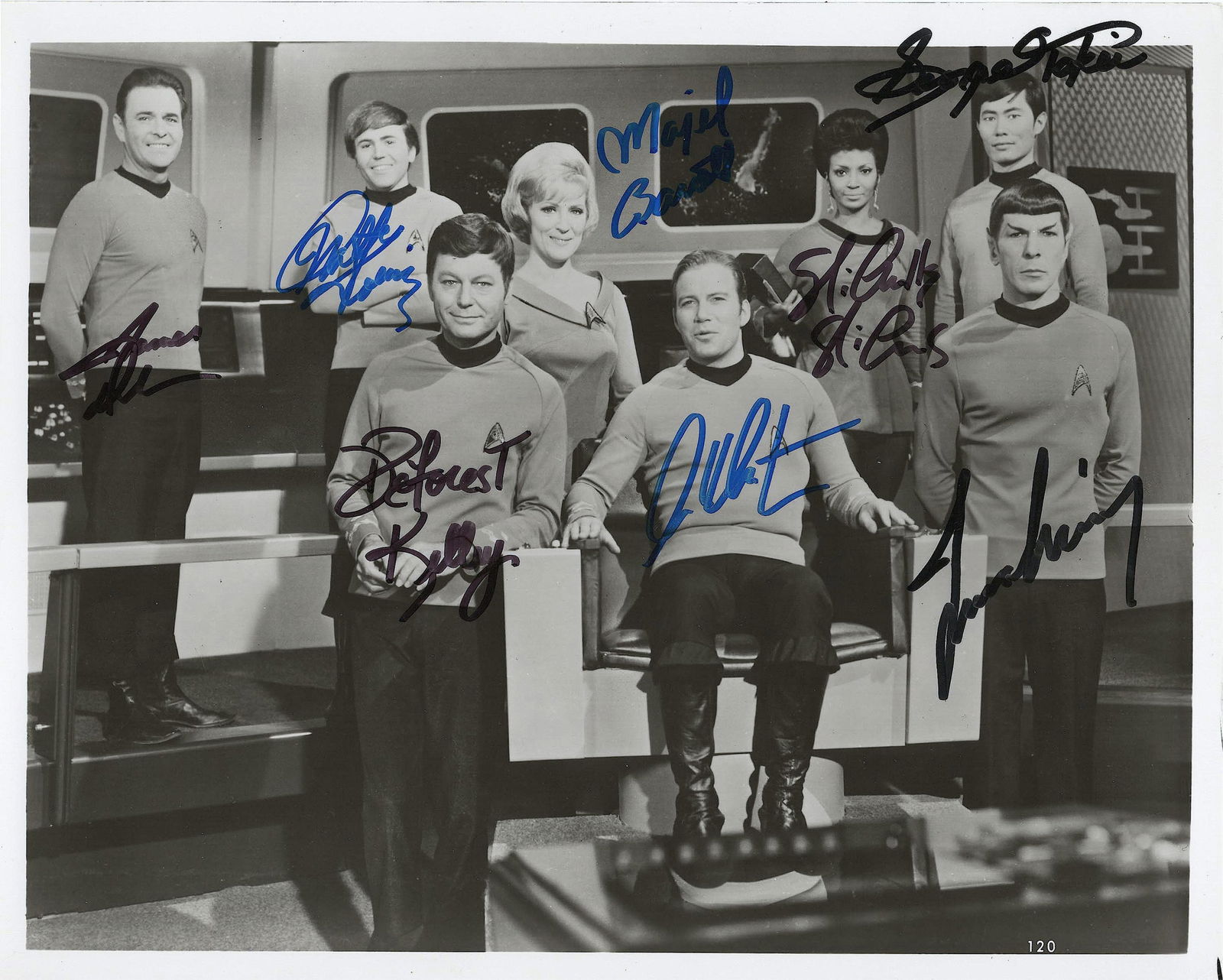 (STAR TREK): S.P. 10 x 8 in. b/w, a scene from the series showing the full cast on the flight deck. Boldly signed by: WILLIAM SHATNER, LEONARD NIMOY, DEFOREST KELLEY, GEORGE TAKEI, JAMES DOOHAN, NICHELLE NICHOLS,