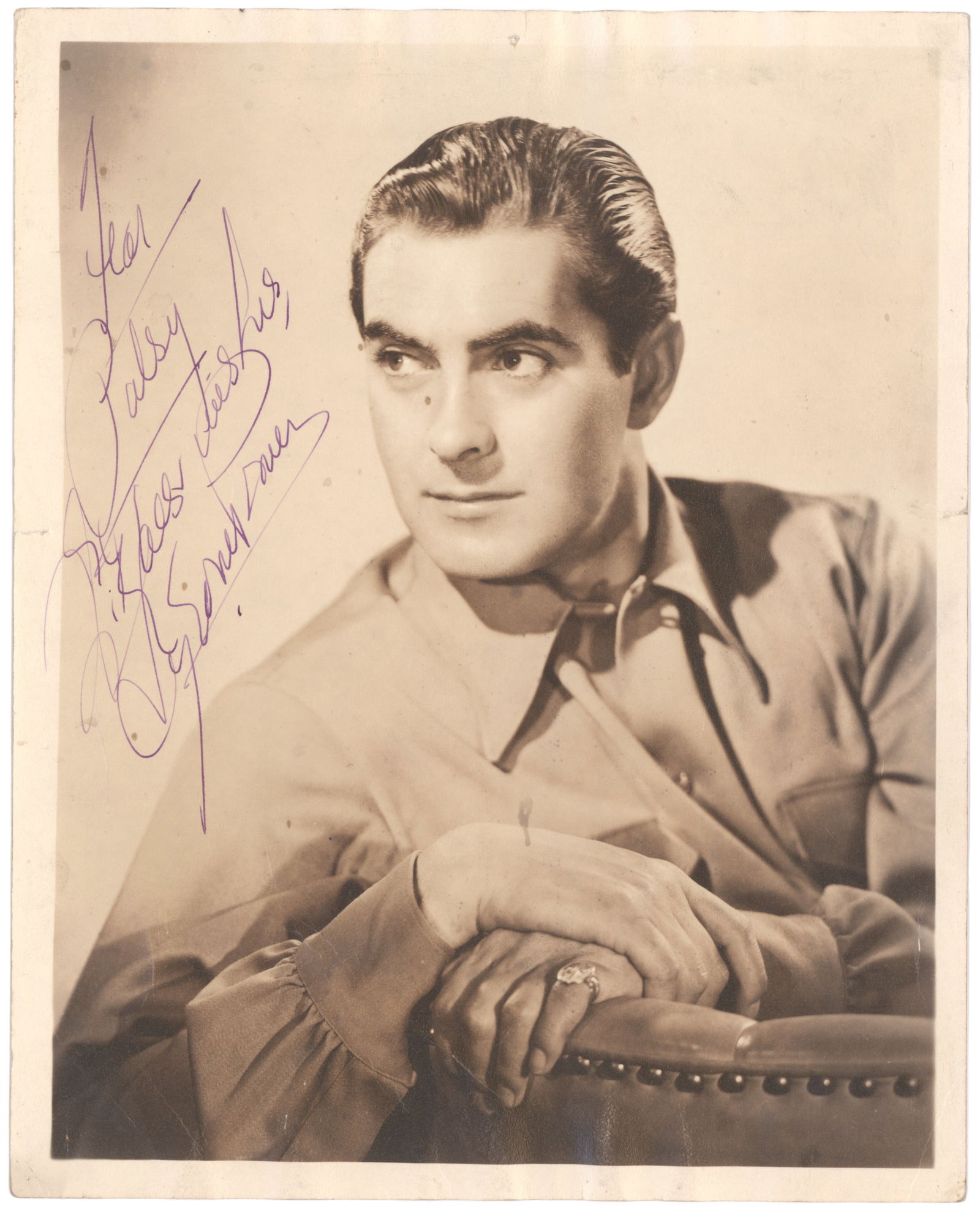 TYRONE POWER: (1914 - 1958) American matinee idol best known for his roles in swashbucklers such as 'Blood and Sand', 'Prince of Foxes' and 'The Mark of Zorro'. Vintage I.S.P., 8 x 10 in. sepia, an early chest, up