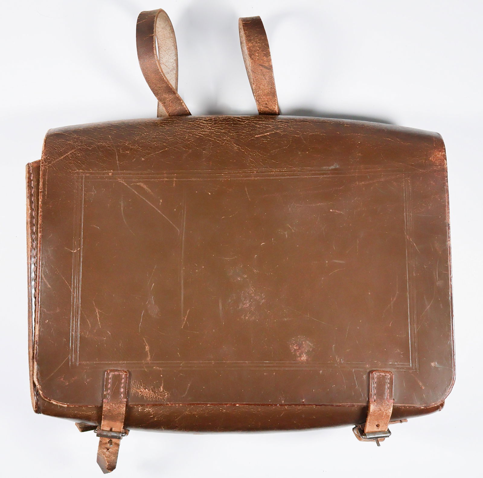 WARTIME BACKPACK OF GEN. FRANZ HALDER: Wartime brown leather backpack owned and used by German Gen. FRANZ HALDER (1884–1972). The 13.25 x 10 x 3.5 in. pack bears a thick leather front flap with embossed trim, secured at the bottom
