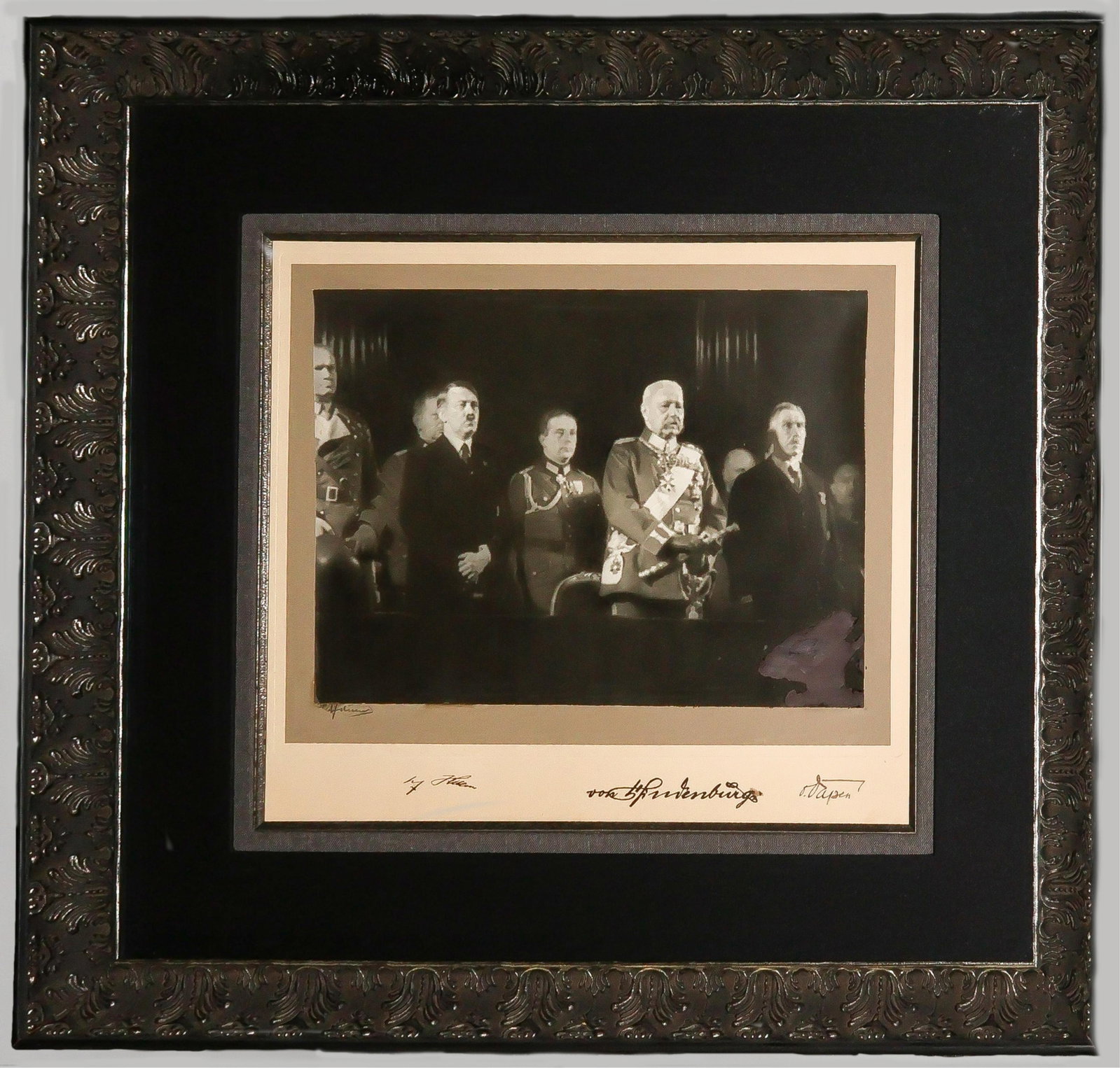 ADOLF HITLER, PAUL VON HINDENBURG, AND FRANZ VON PAPEN SIGNED PHOTOGRAPH: THE ONLY KNOWN PHOTO SIGNED BY HITLER, HINDENBURG AND VON PAPEN, TAKEN IN 1933 Extraordinary rare signed photograph, 14 7/8 x 10 7/8 in. b/w, framed to 28.5 in x 24.5 in., boldly signed on the mount