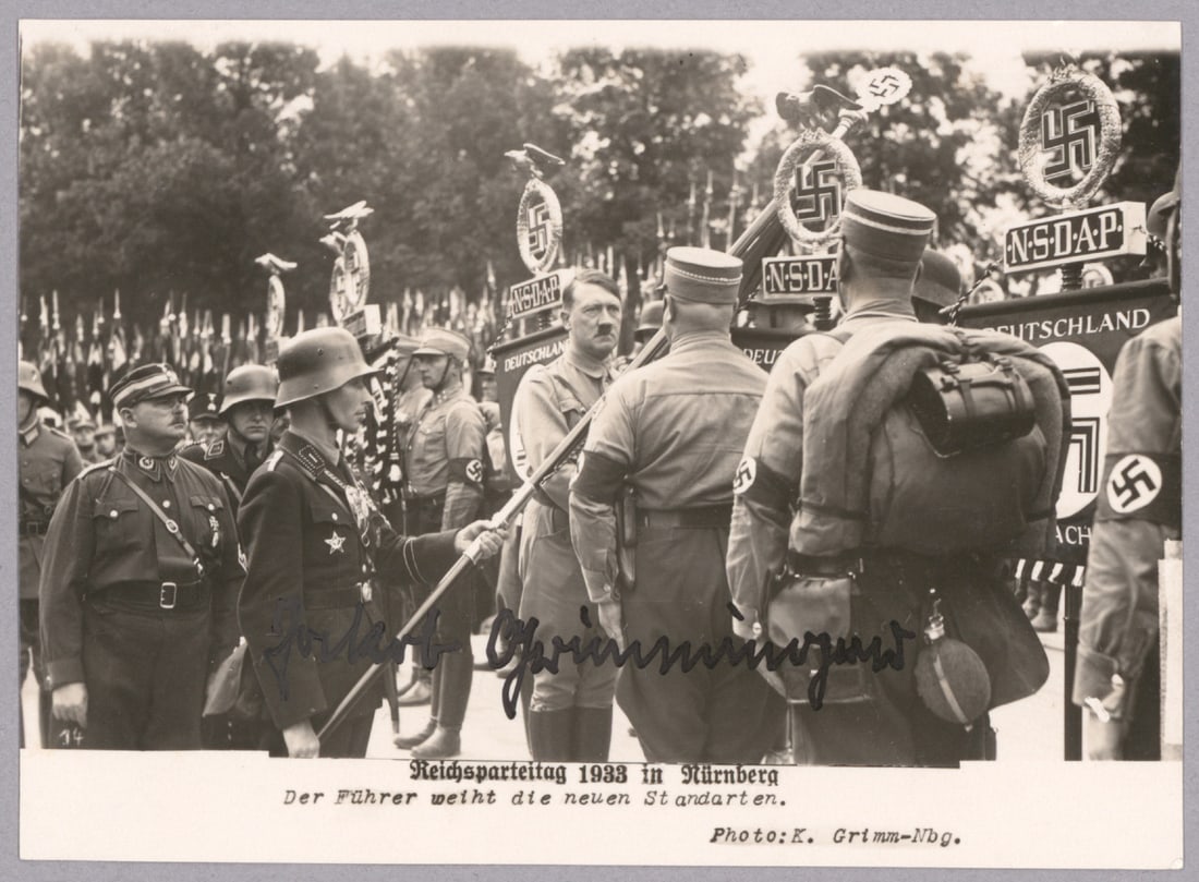 JAKOB GRIMMINGER: (1892 - 1969) SS officer famous for carrying the Blutfahne, the blood-stained flag from the ‘Beer Hall Putsch’ in which Grimminger had also participated. Tried in 1946, all of his